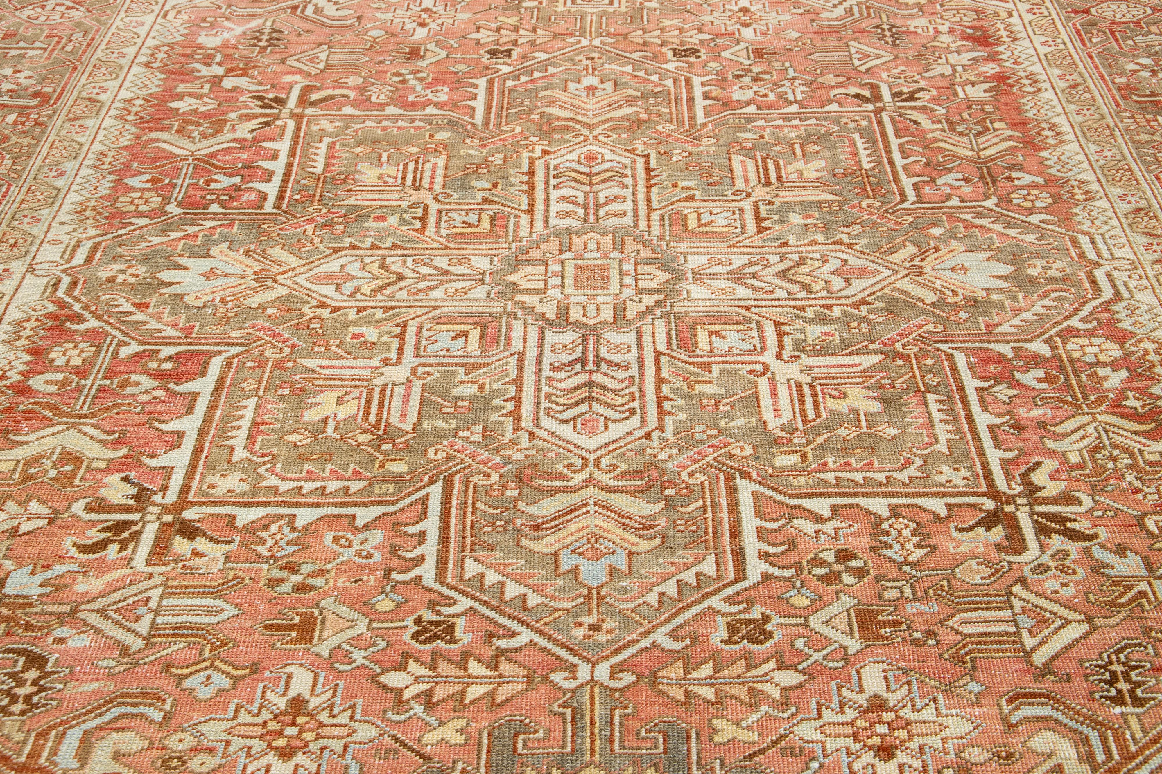 1920s Persian Heriz Antique Wool Rug In Rust Color Featuring a Medallion Motif For Sale 1