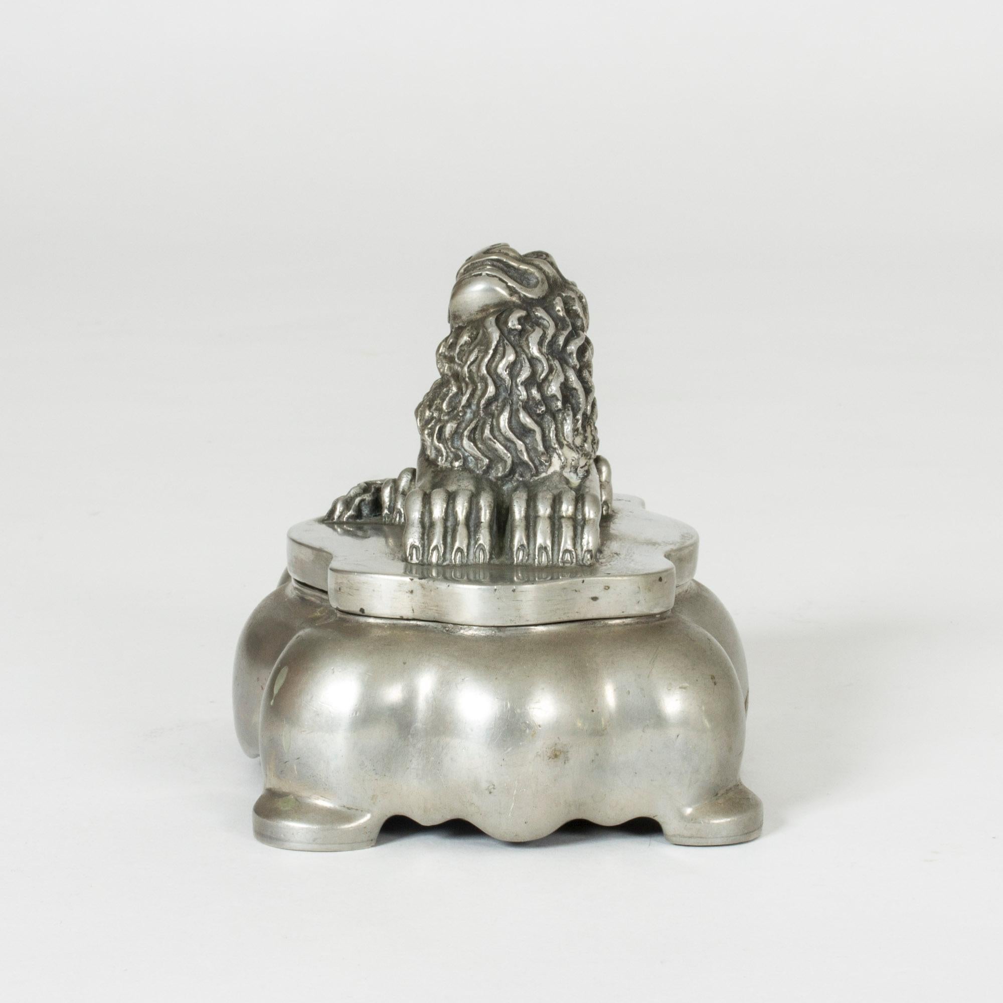 Pewter inkwell by Anna Petrus, designed in the period 1925-1927. Adorned with the expressive lion that is one of Petrus’ signature designs. Loose glass insets in the indentures made for ink.

Anna Petrus was a Swedish sculptor, Industrial designer