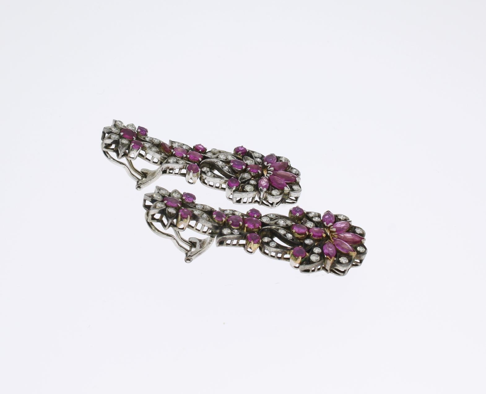 Europe, 1920s. Flower design set with 34 navette-cut and round-cut pink sapphires overall approximately 3,50 ct. and 62 single-cut and full-cut diamonds with a total weight of ca. 1,20 ct. Mounted in silver. Weight: 18,17 grams. Length: 1.97 in ( 5