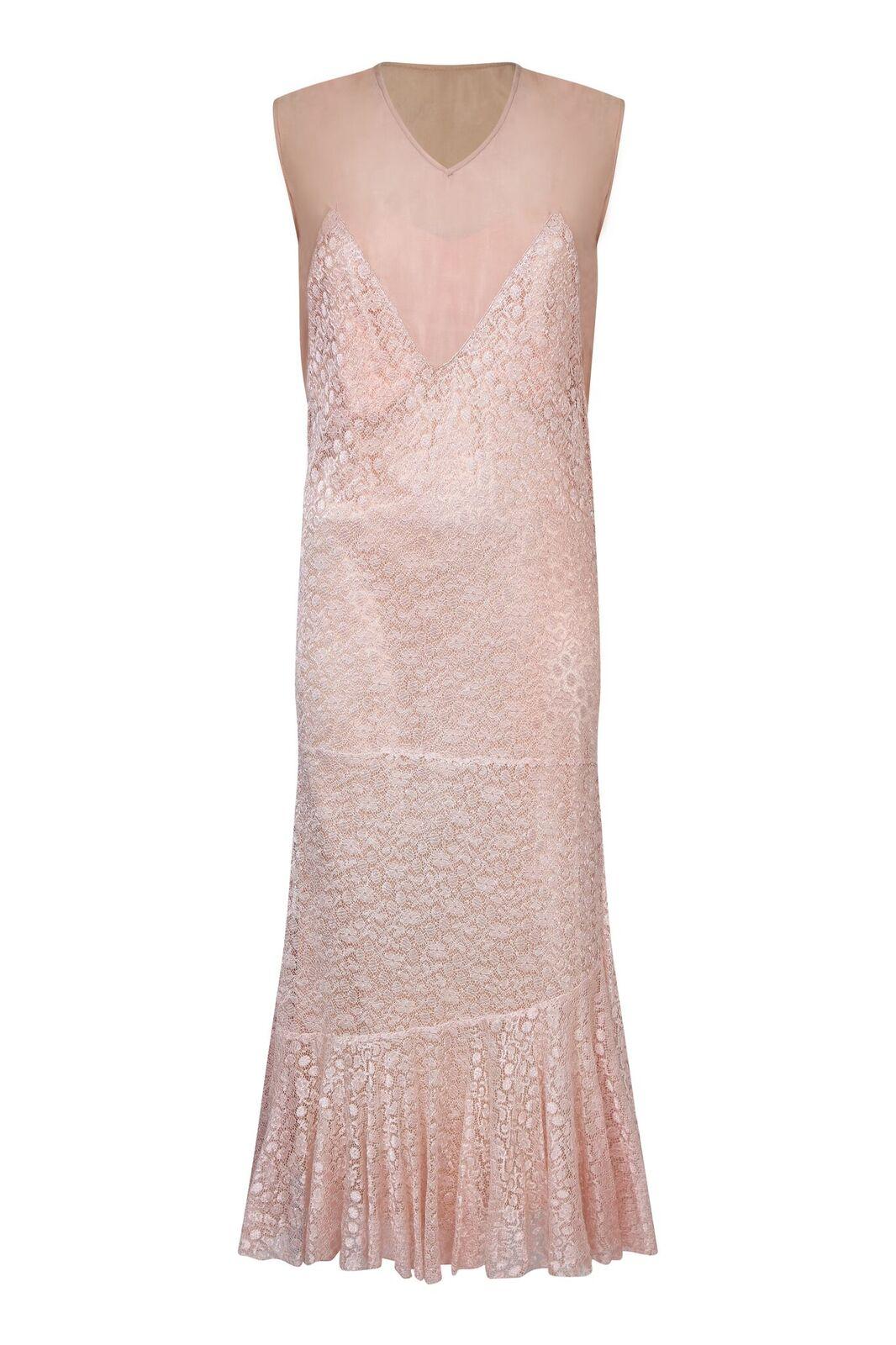 This lovely 1920s satin and lace three piece set is in impeccable vintage condition and could easily be worn by a vintage bride. The set is comprised of a luxurious silky satin slip in warm pink/peach, with a shift style overlay dress almost