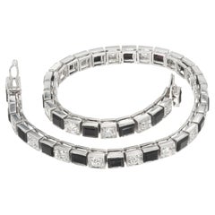 Bracelet à maillons articulés des années 1920 en platine avec 2,20 ct de diamants et d'onyx