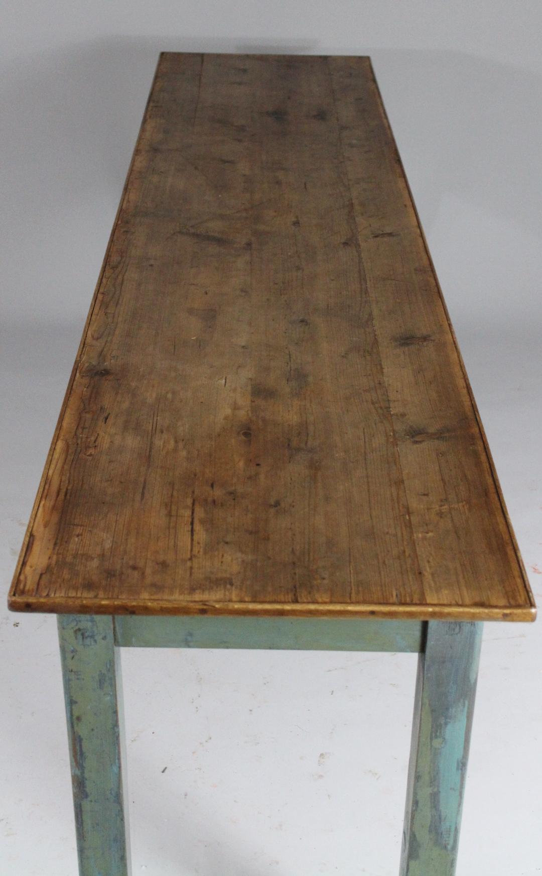 Long pub table from the 1930s. Material is spruce wood. Several layers of old paint. The table is in good stabile condition with nice patina.