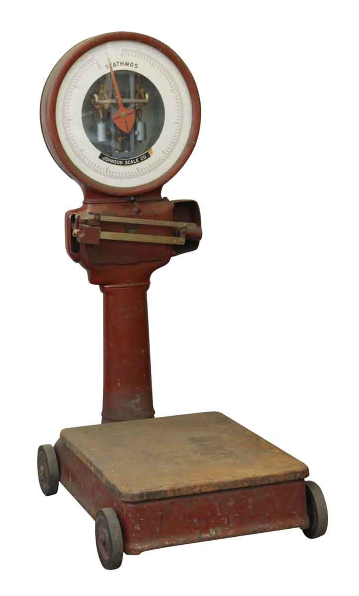 1920s large red Johnson Scale Co. Stathmos scale with wheels. This can be seen at our 400 Gilligan St location in Scranton, PA