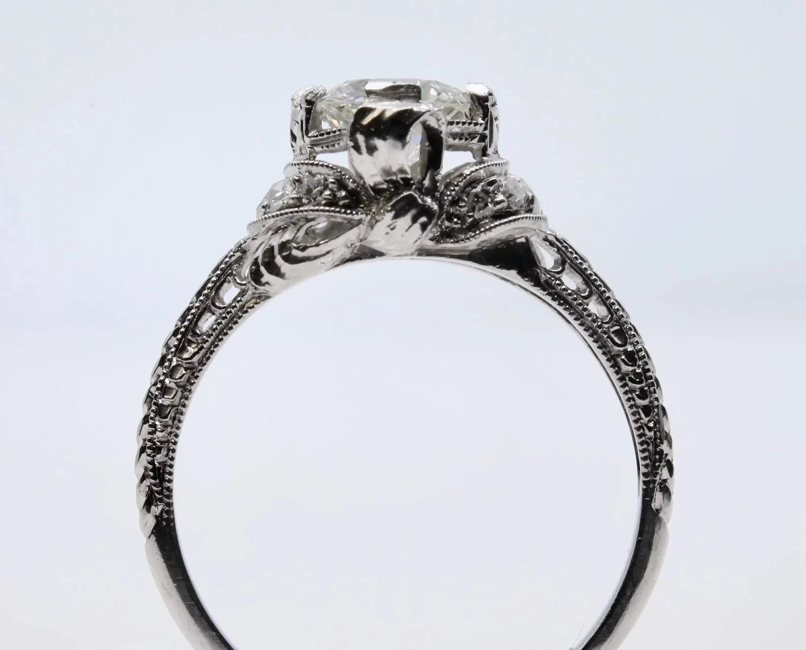 1920's Ribbon Motif Art Deco 0.76ct Diamond Engagement Ring in Platinum In Good Condition For Sale In Boston, MA