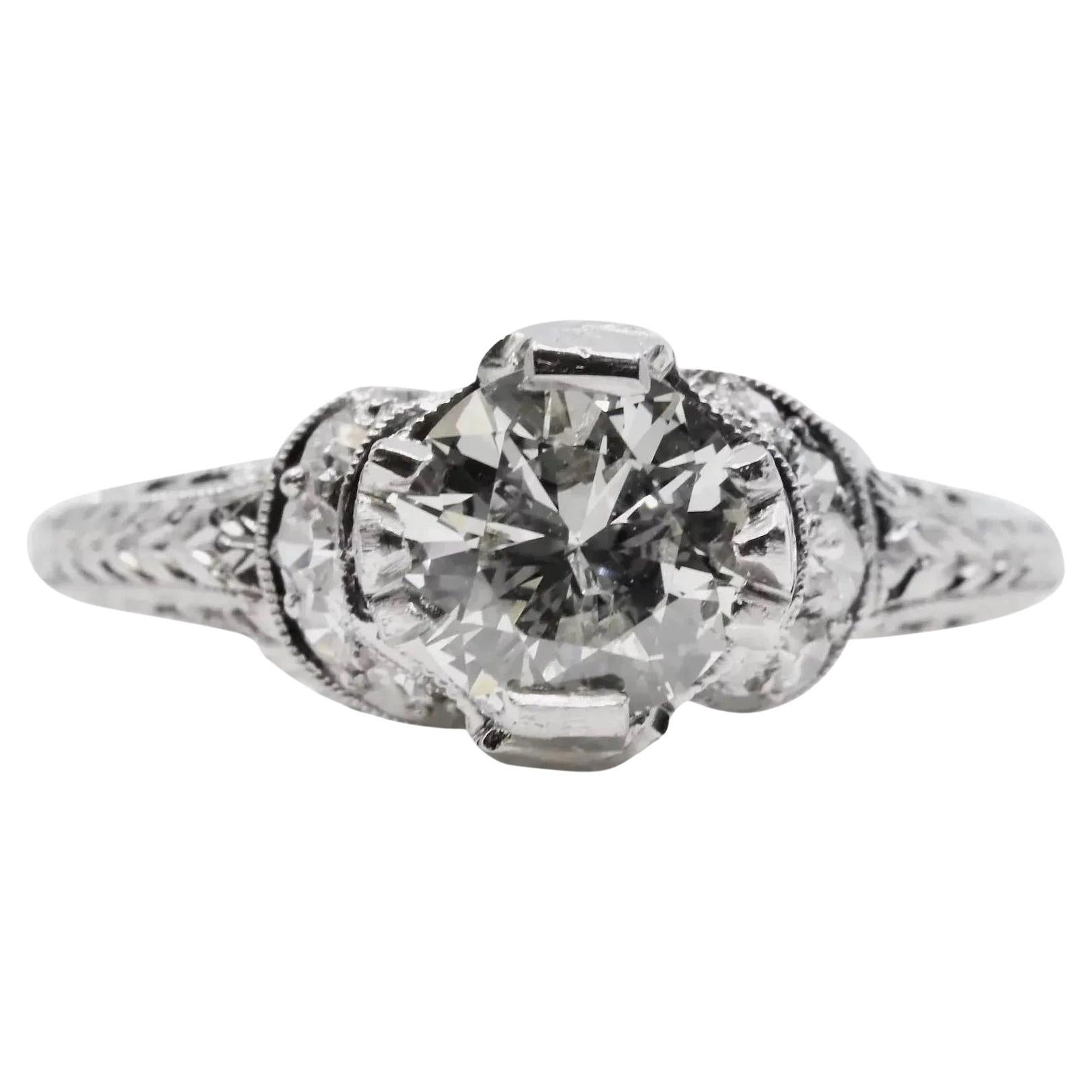 1920's Ribbon Motif Art Deco 0.76ct Diamond Engagement Ring in Platinum For Sale