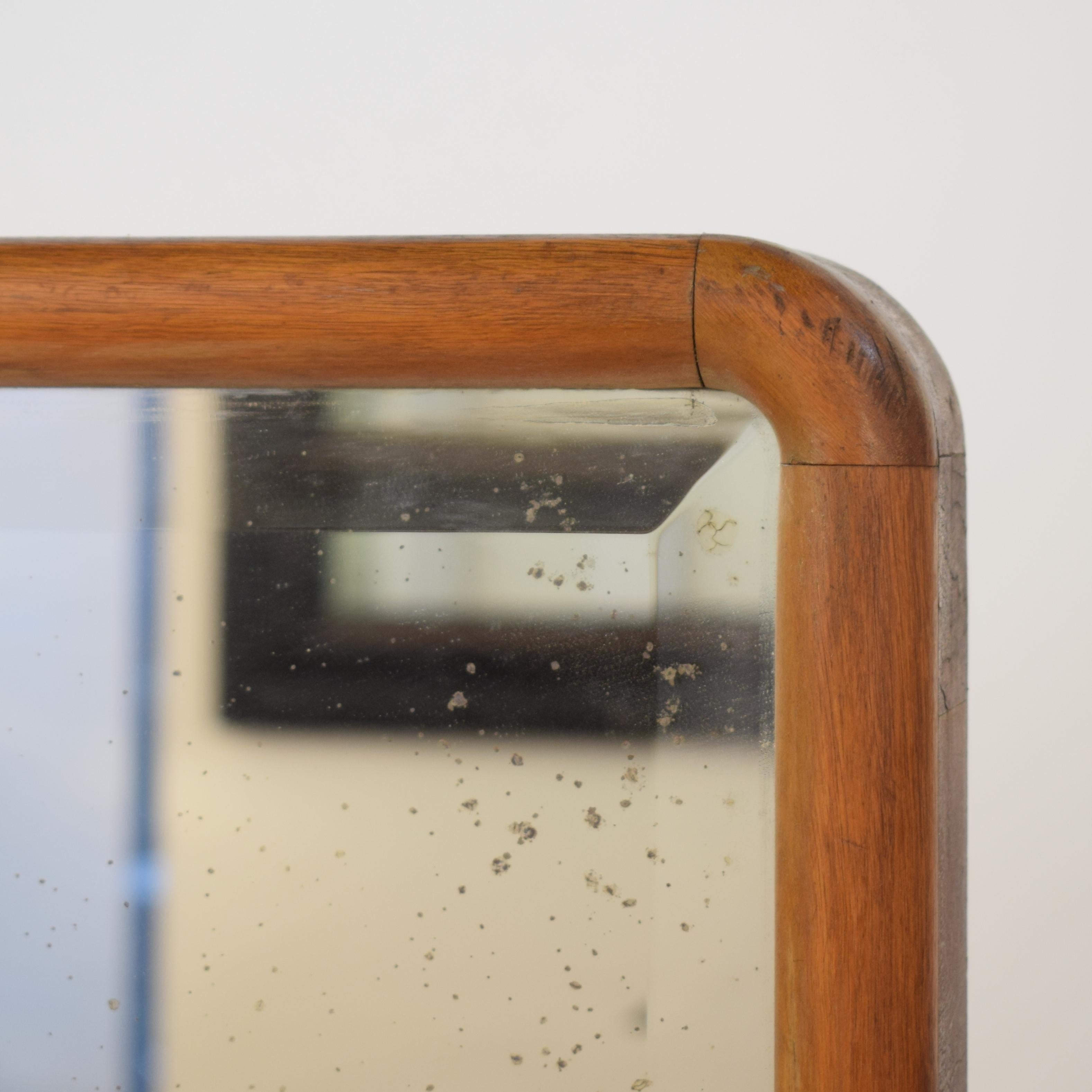 This beautiful 1920s rotatable German Art Deco Cheval Dressing Mirror has still its original mirror glass. It is light brown birch veneer on pine.
The mirror without base is 150cm in height, 53cm wide and 7cm deep. It is connected with a metal pin