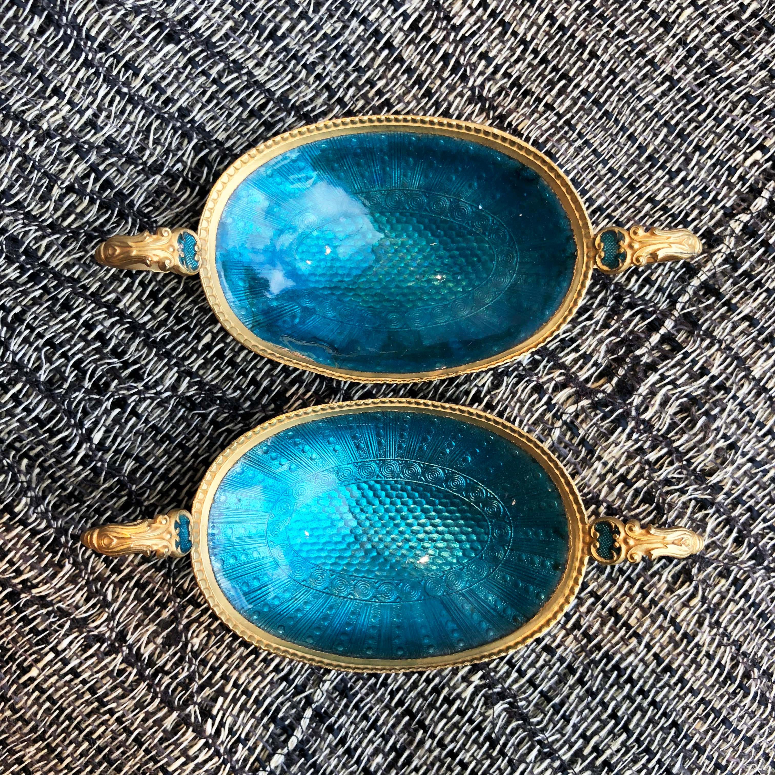 Two pairs of highly collectable salt and pepper dishes from early 1900’s. Gold plated with blue or yellow enamel. Authentication stamp is evident on each dish. Sold as a pair.

10W x 4.5D x 2H cm each

Good antique condition