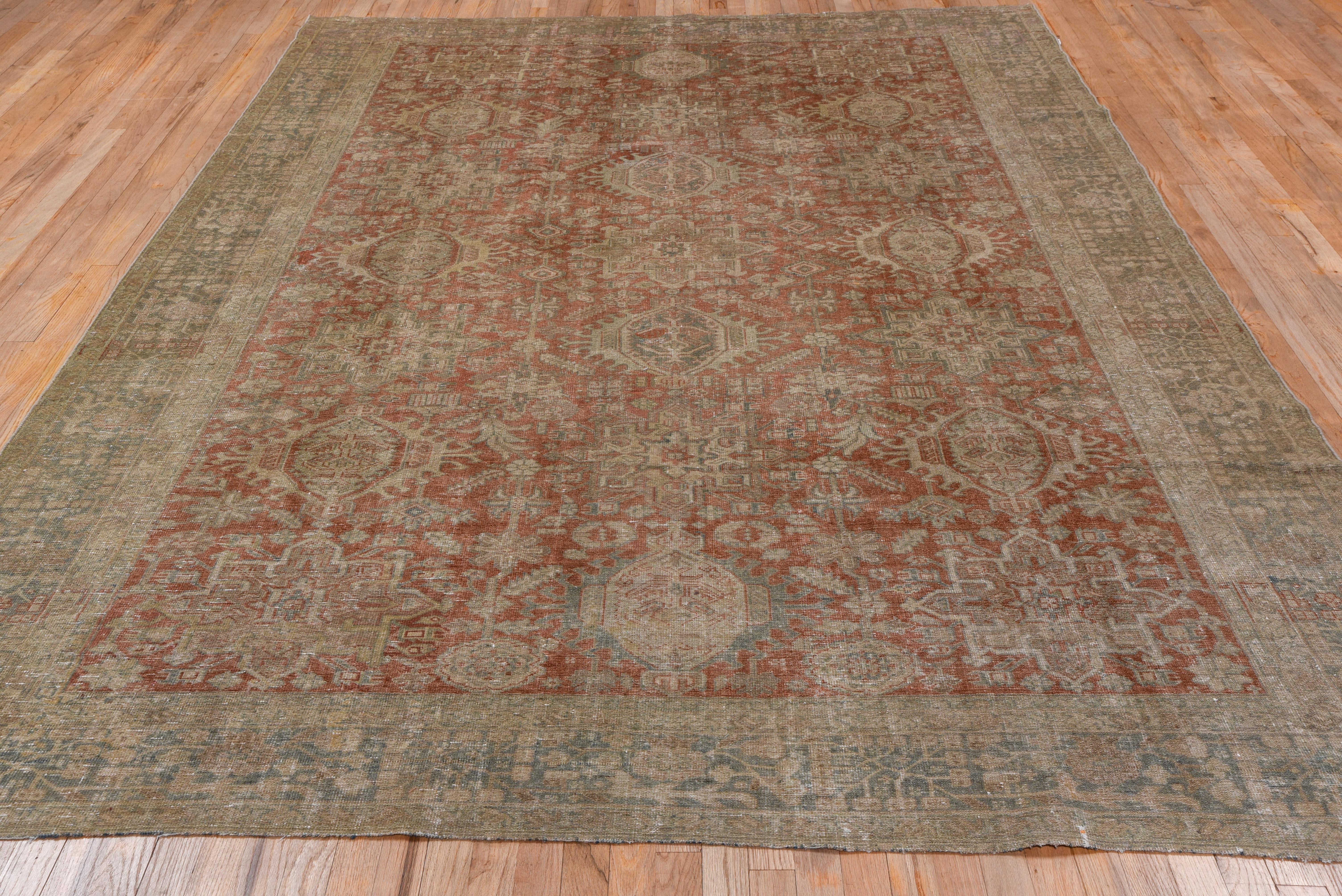 1920s Rustic Antique Persian Karaje Rug, Allover Rust Field, Teal Borders In Good Condition For Sale In New York, NY