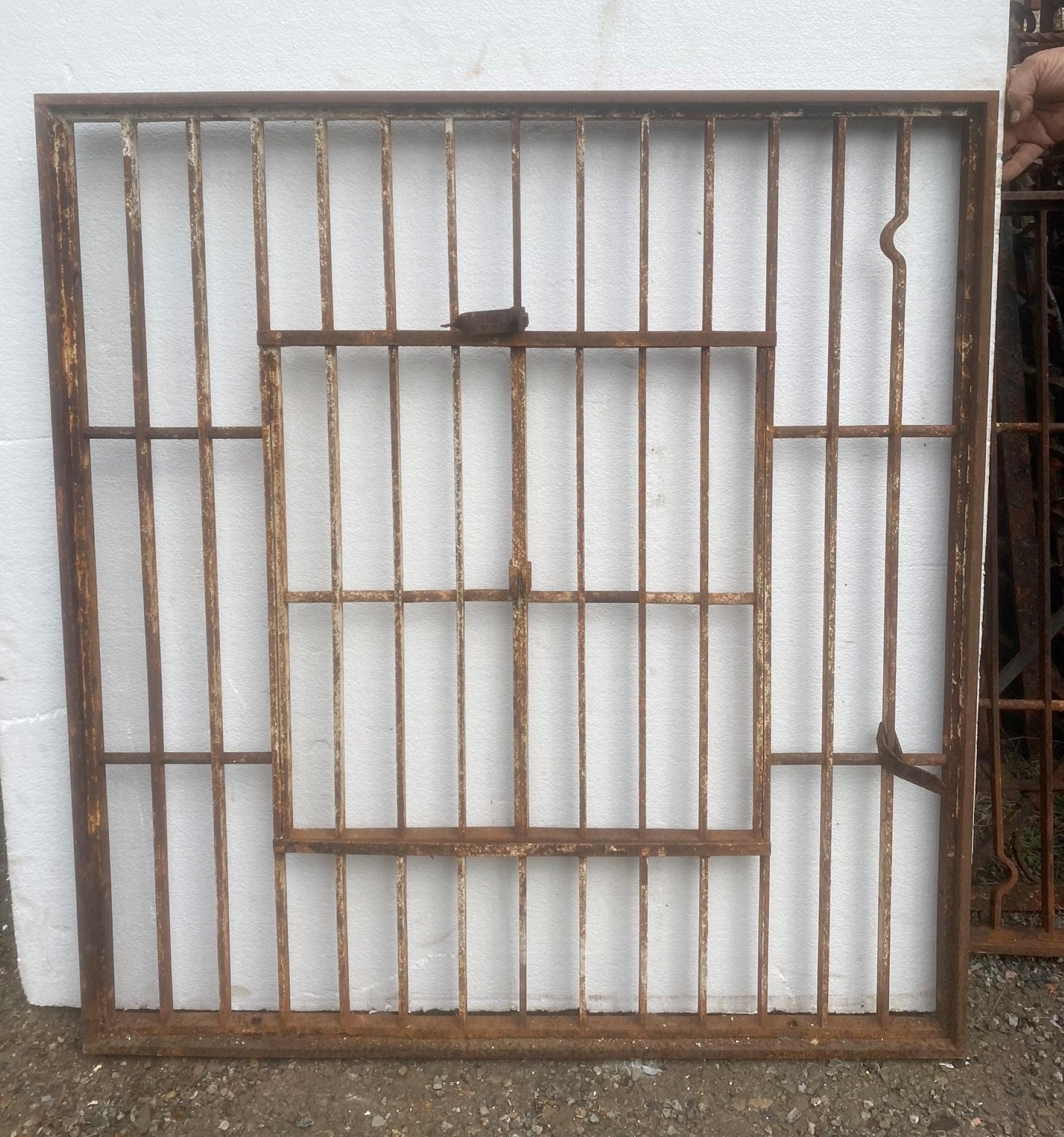 Early 20th century wrought iron or steel jail window with a double door hatch that opens. In salvaged condition. This can be seen at our 400 Gilligan St location in Scranton, PA.