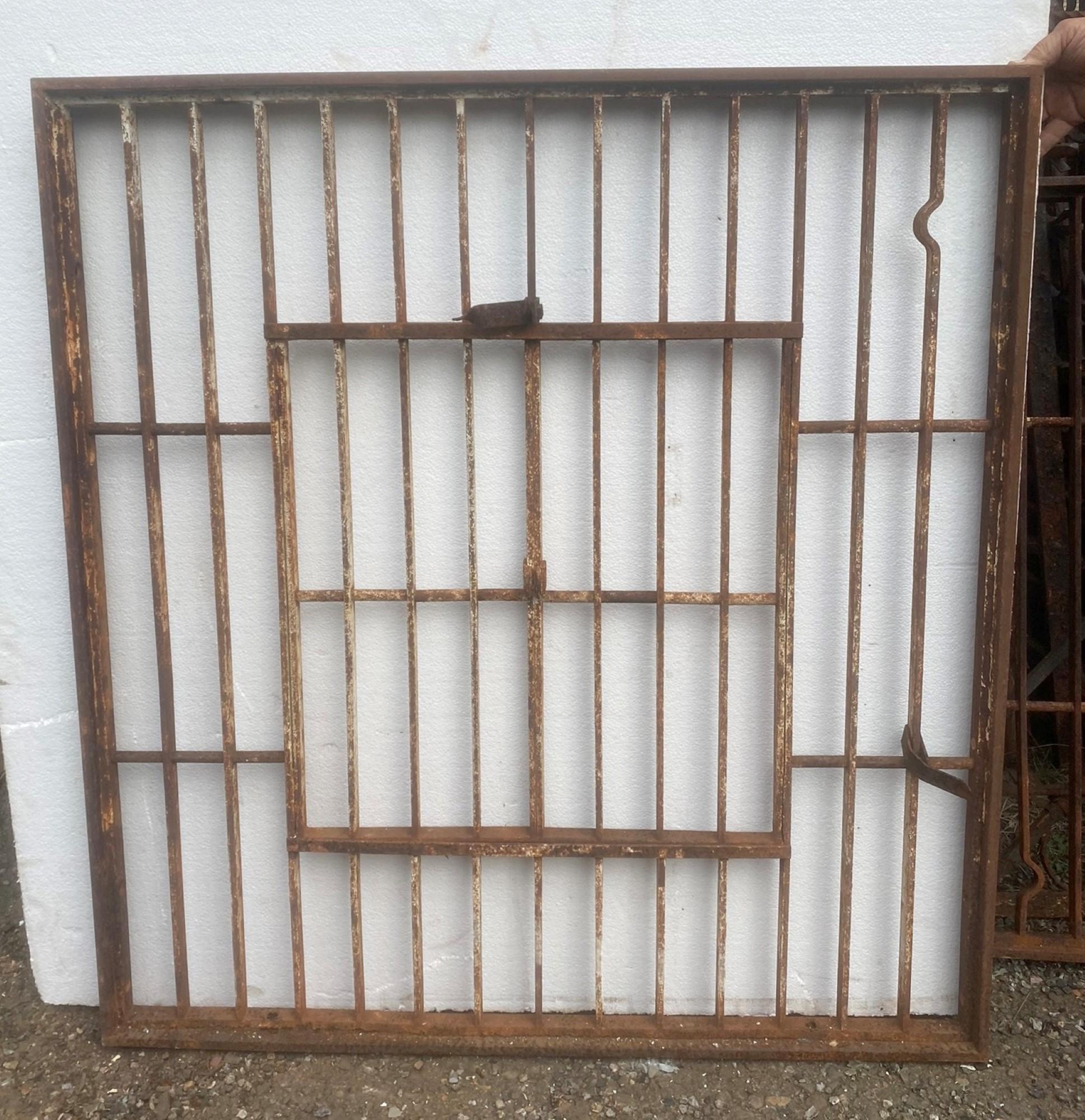 North American 1920s Salvaged Wrought Iron Jail Style Window with Double Door Opening