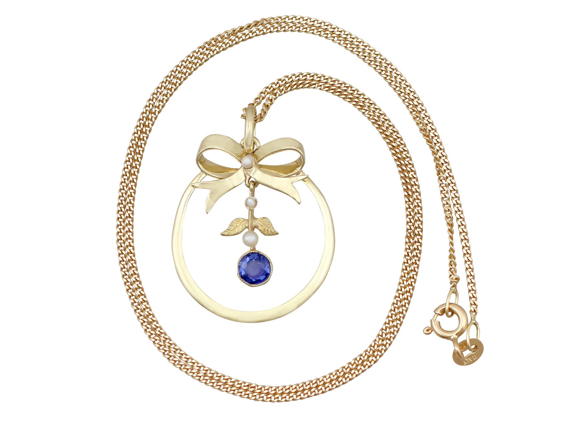 An impressive antique 0.42 carat sapphire and seed pearl, 15 carat yellow gold pendant; part of our diverse antique jewellery and estate jewelry collections.

This fine and impressive antique sapphire pendant has been crafted in 15ct yellow