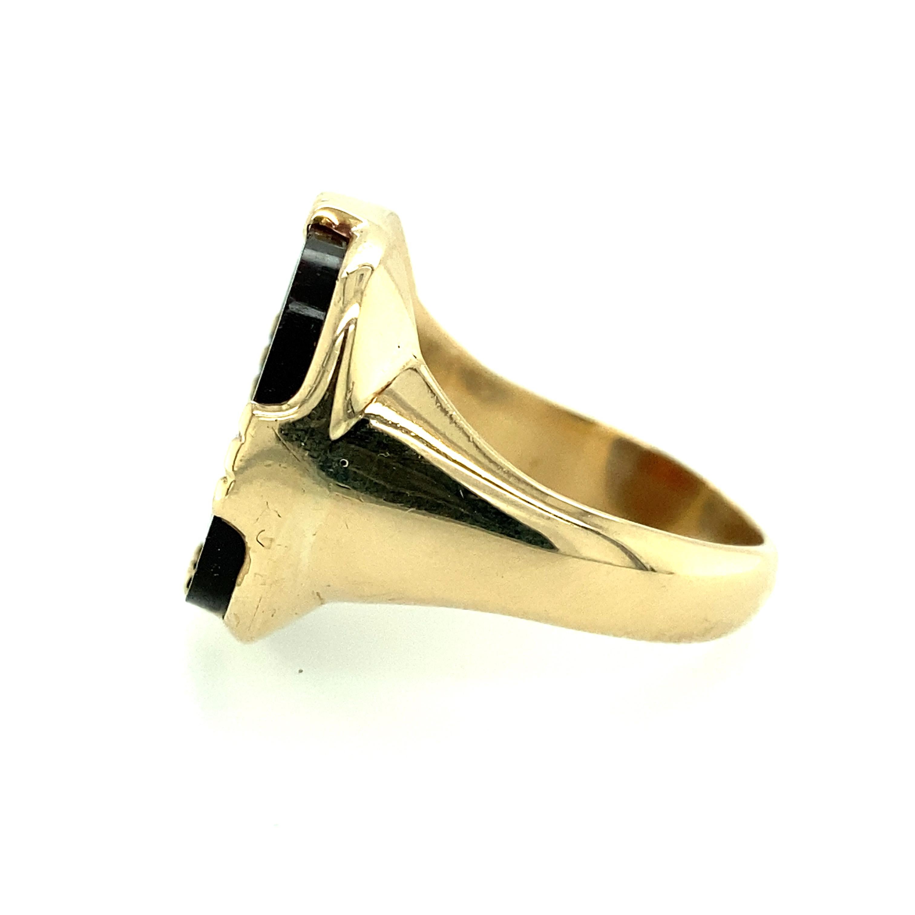 One 14 karat yellow gold estate sardonyx intaglio ring with male and female carving. The top of the ring measures 0.75x 1 inch and weighs 11.66 grams.  The shank measures 8.55mm near the top of the ring and tapers to 3.6mm at the base.  Finger size