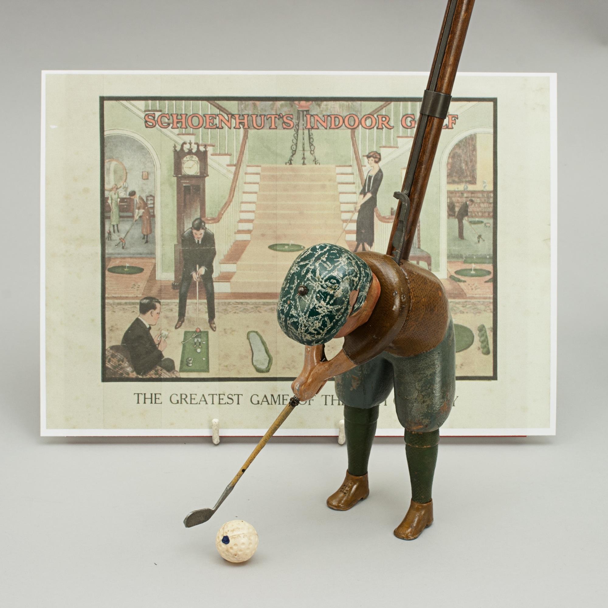 Schoenhut indoor golf toy, Tommy Green.
This indoor golfer is called Tommy Green. He is a 6 ½' tall wooden golfing manikin attached to a 30 ½' wooden shaft. He is so contrived that at the will of the player he can be made to execute an actual golf