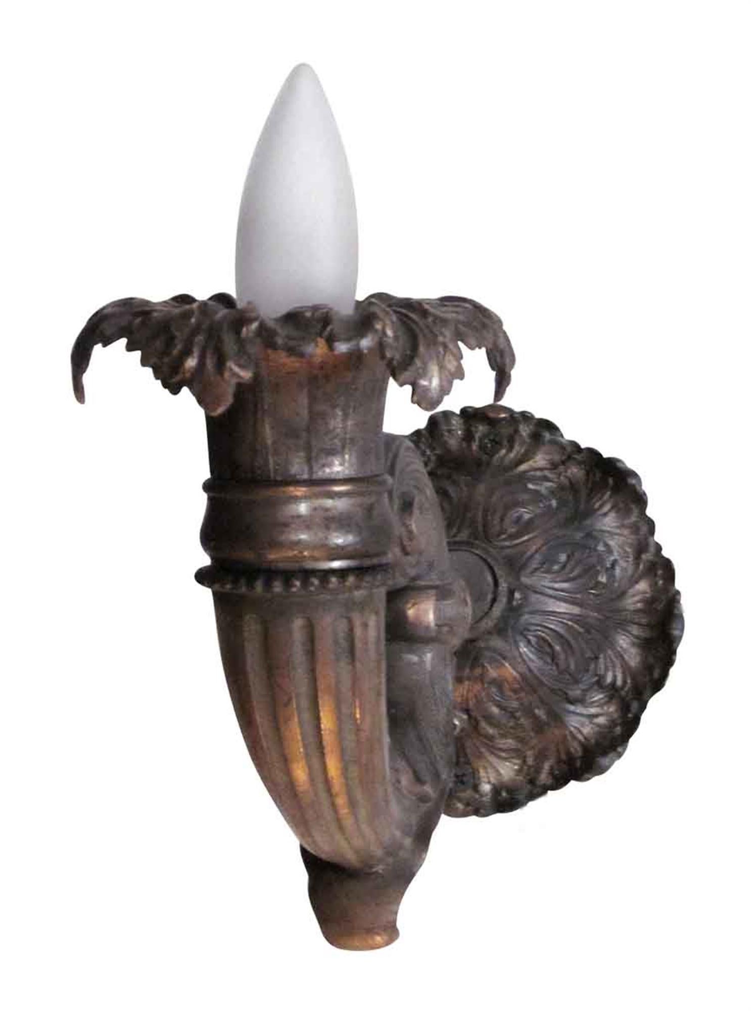 1920s seven-piece set of ornate double arm and single arm bronze sconces. Set includes 5 double and 2 single sconces. This can be seen at our 333 West 52nd St location in the Theater District West of Manhattan.