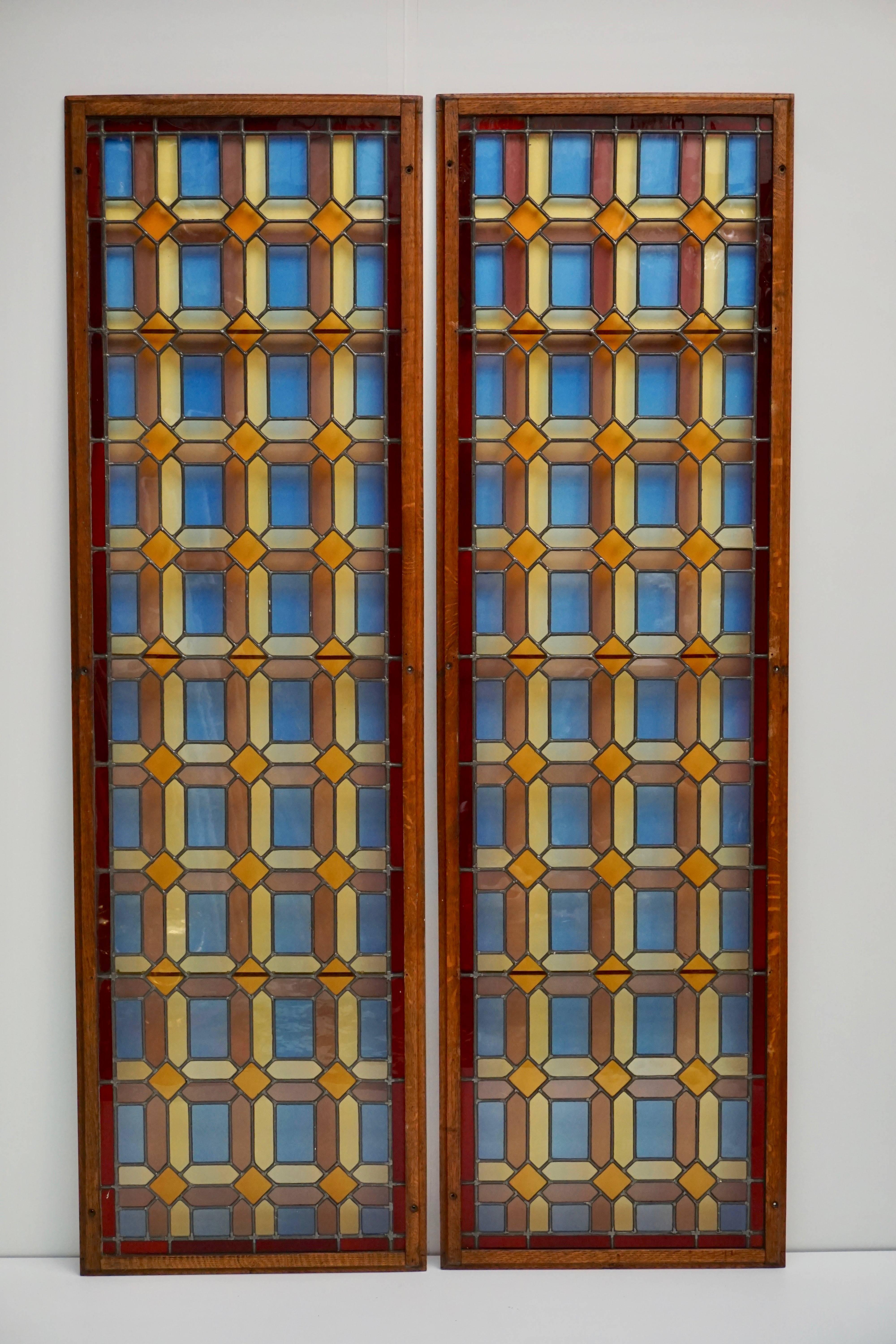 Two stained and multicolored leaded glass window panels in wood frame (Priced each).
Measures: Height 194 cm.
Width 58 cm.
Weight 10 kg.

Price per item.