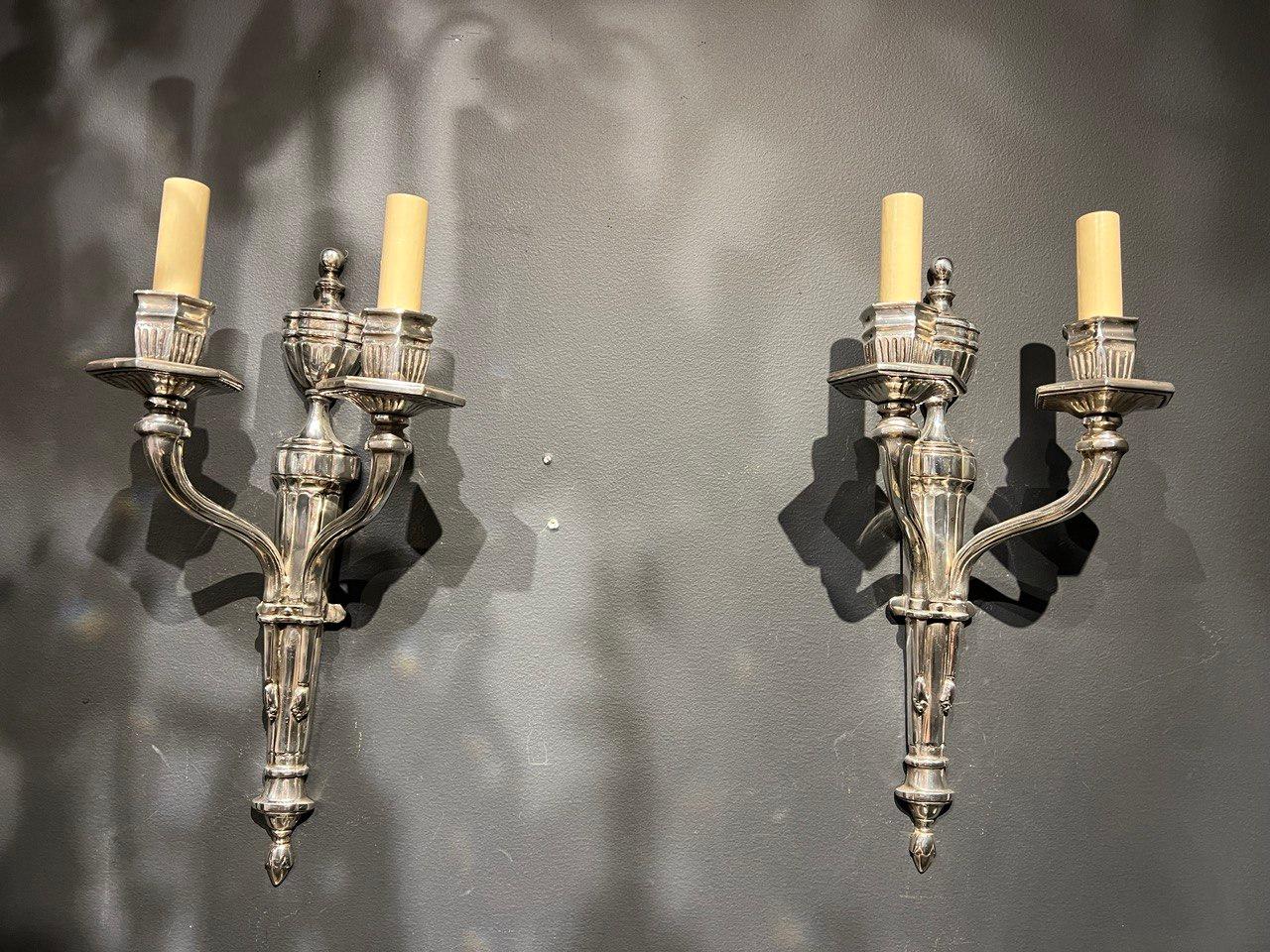 A pair of circa 1920's Caldwell silvered plated sconces