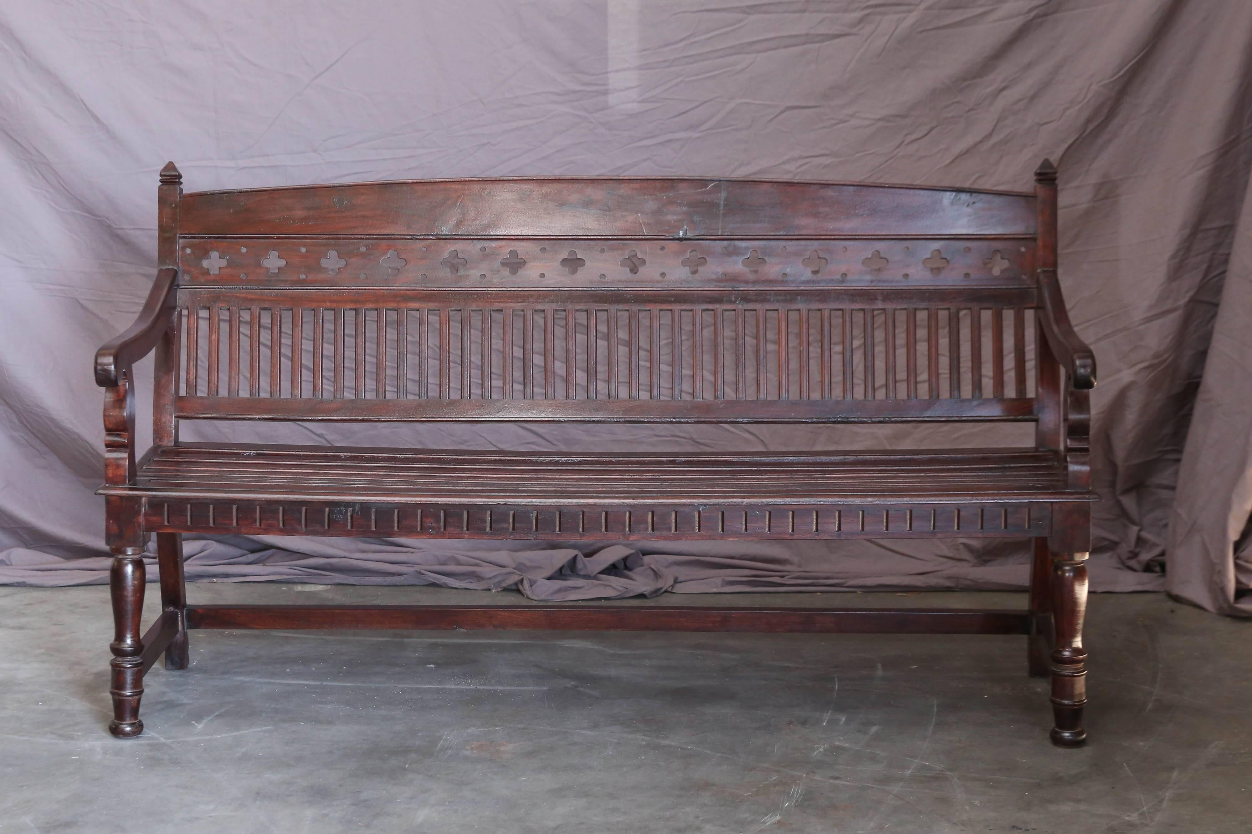 The seat and the back of this bench is shaped for comfort. It is superbly crafted in old world style with religious symbols. It comes from a bishop's abode and is in excellent condition. It is priced low. Will make a great addition to a family room.