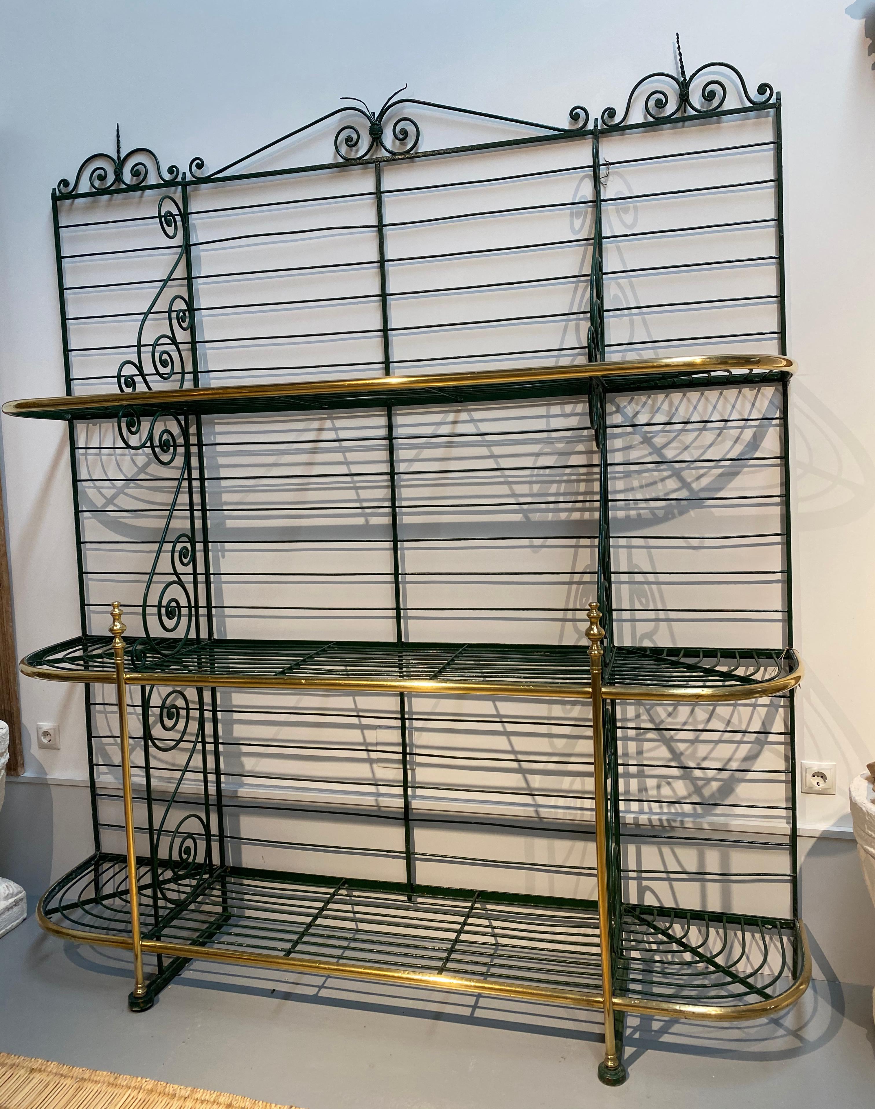 1920s Spanish bronze and iron three shelf bakers rack.