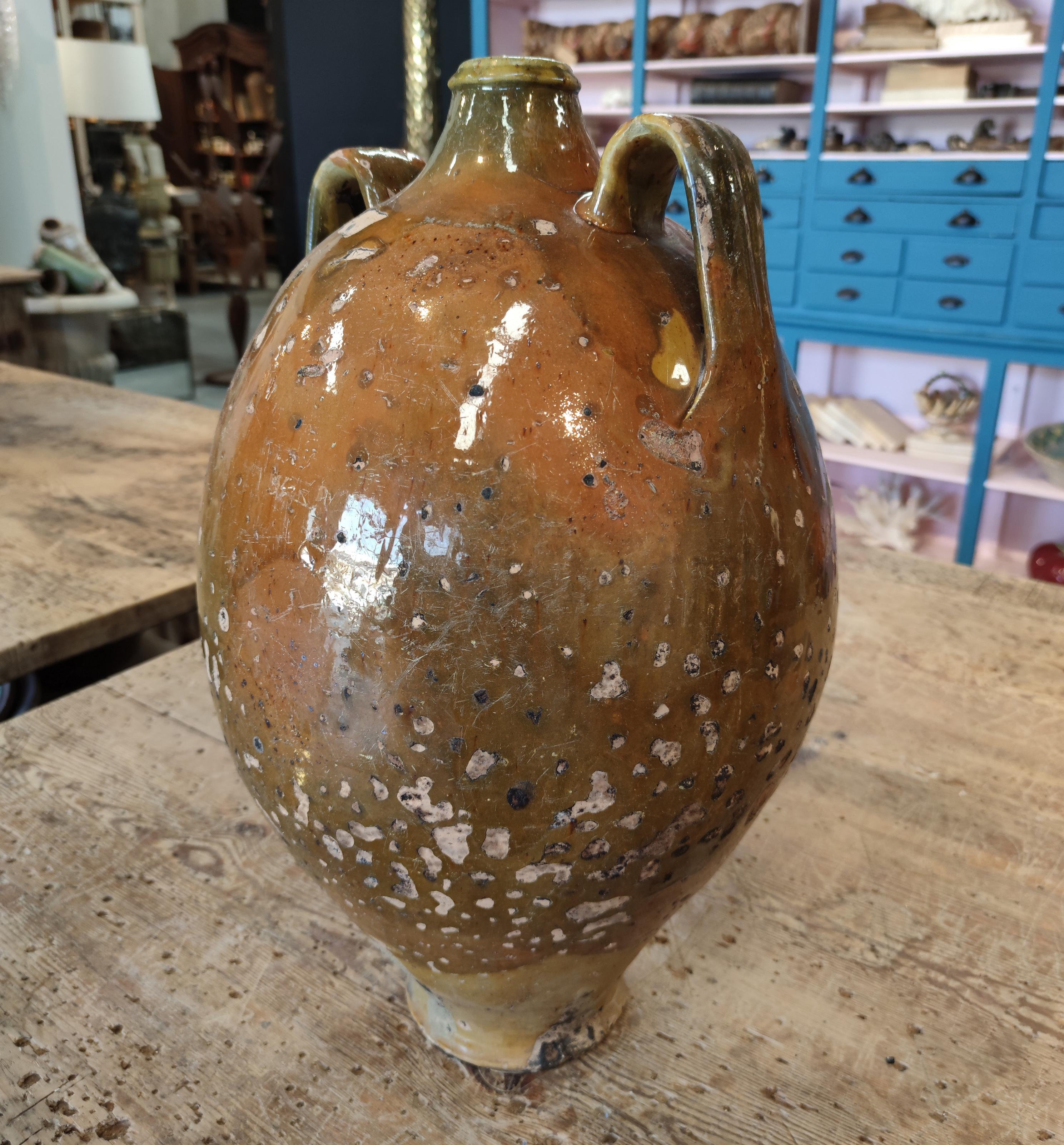 Antique 1920s Spanish glazed ceramic vase with two handles.