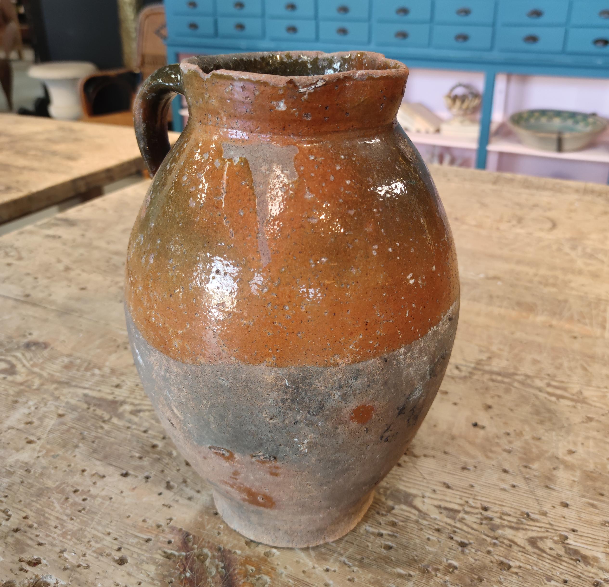 Antique 1920s Spanish glazed ceramic wine jar.
