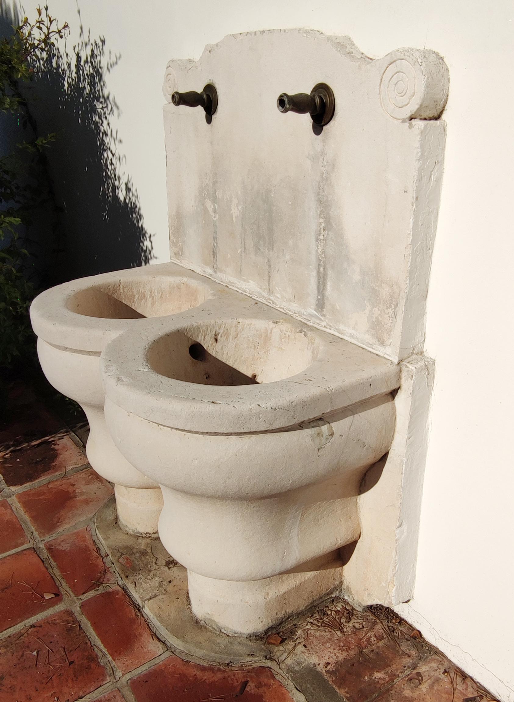 1920s Spanish Hand Carved Limestone Wall Fountain with Two Spouts In Good Condition In Marbella, ES