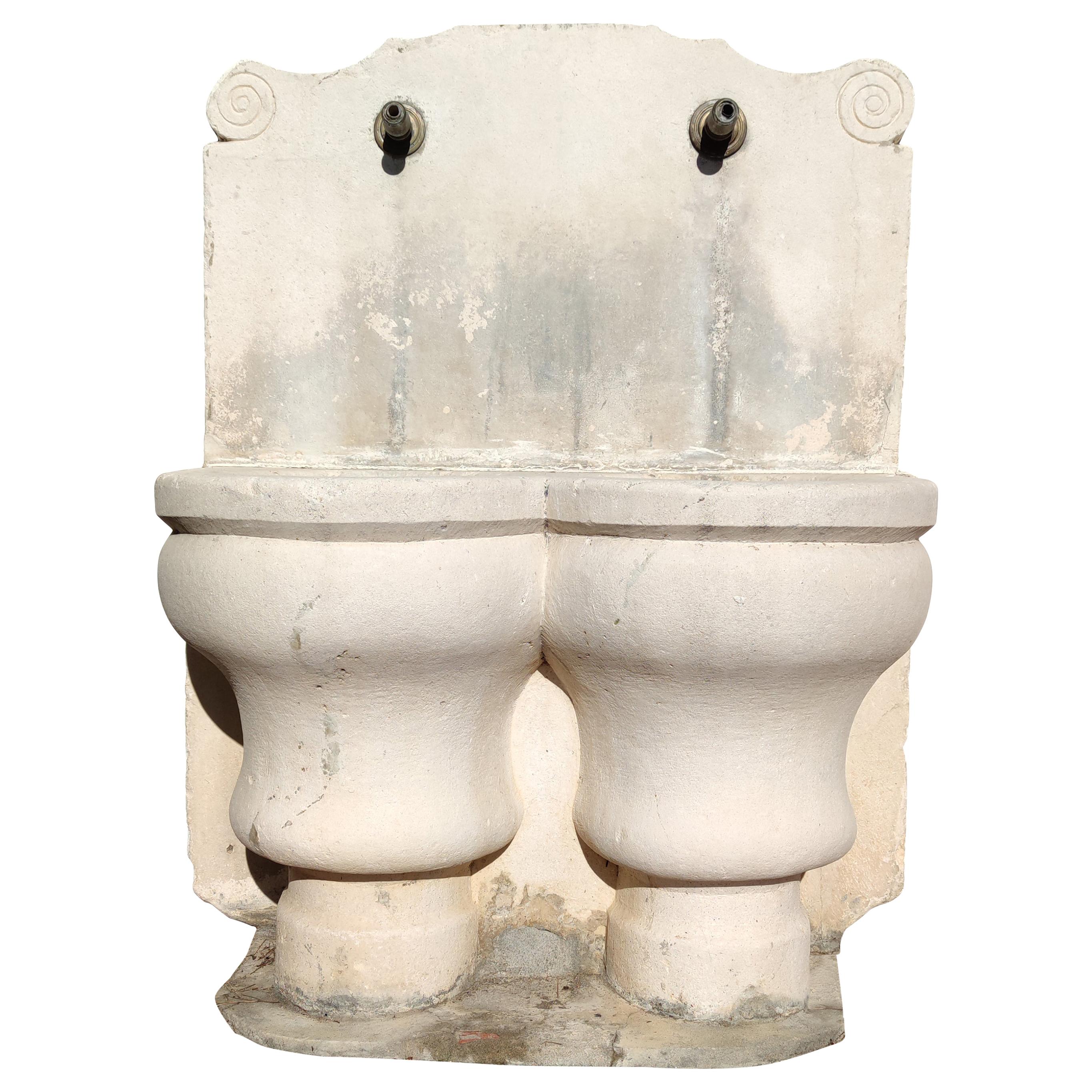 1920s Spanish Hand Carved Limestone Wall Fountain with Two Spouts
