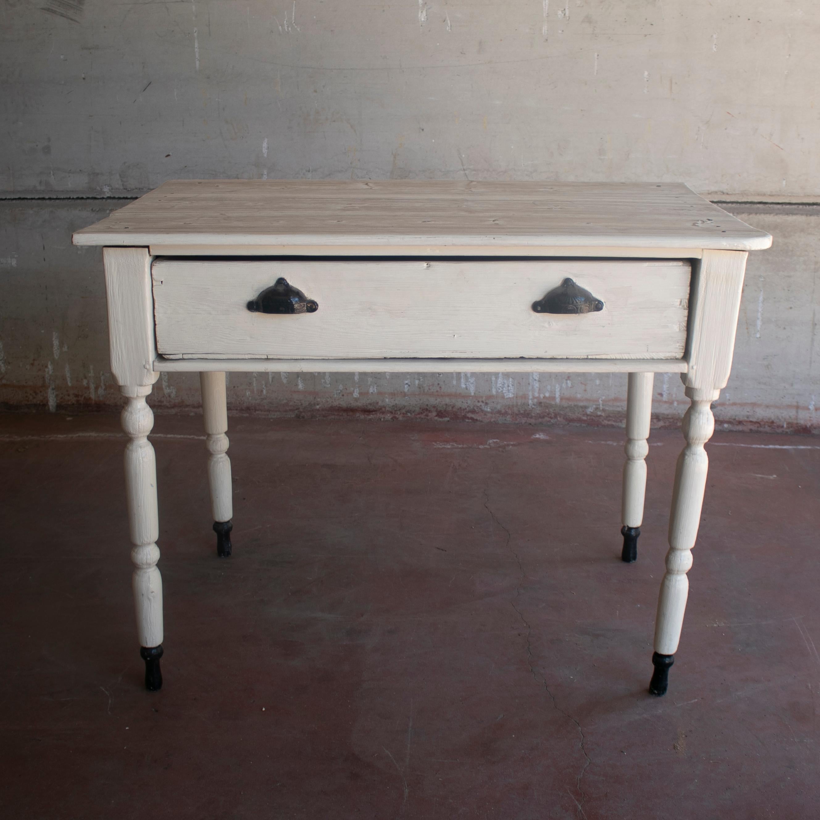 1920s Spanish one drawer farmhouse wooden table painted white.