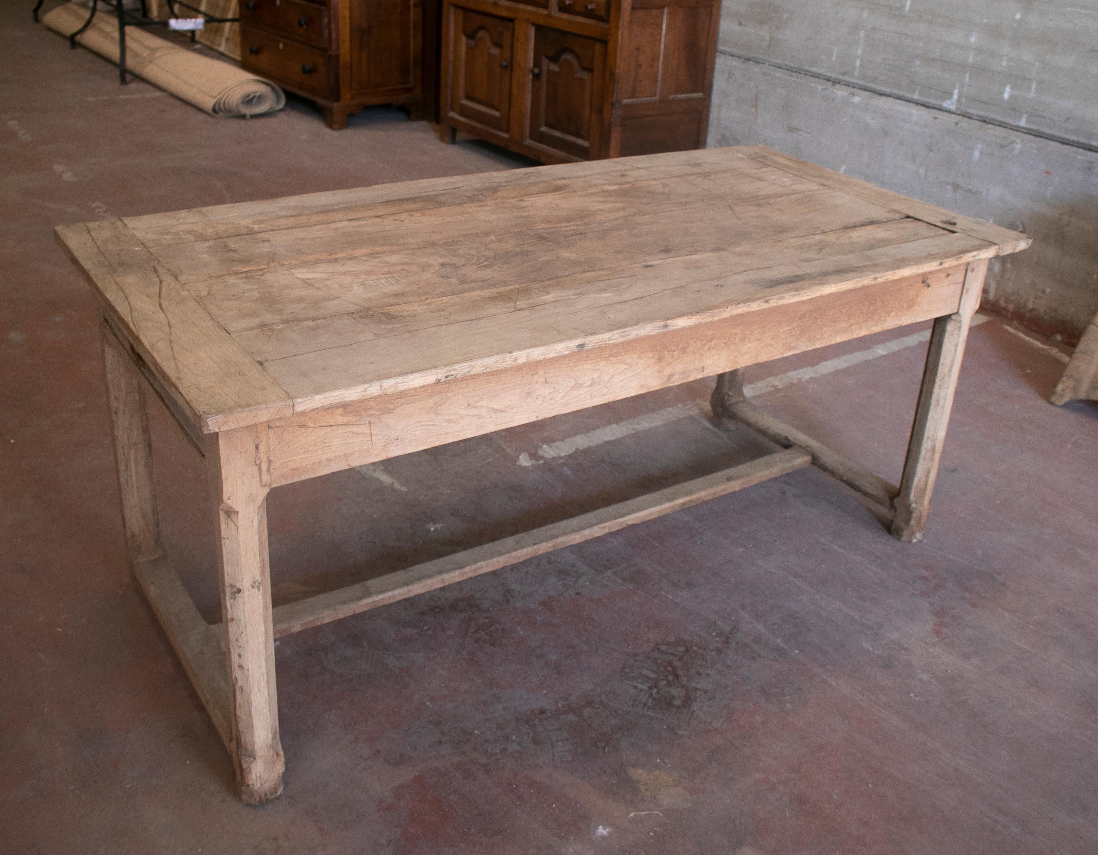 1920s Spanish pine wood farmhouse table with drawers on sides.