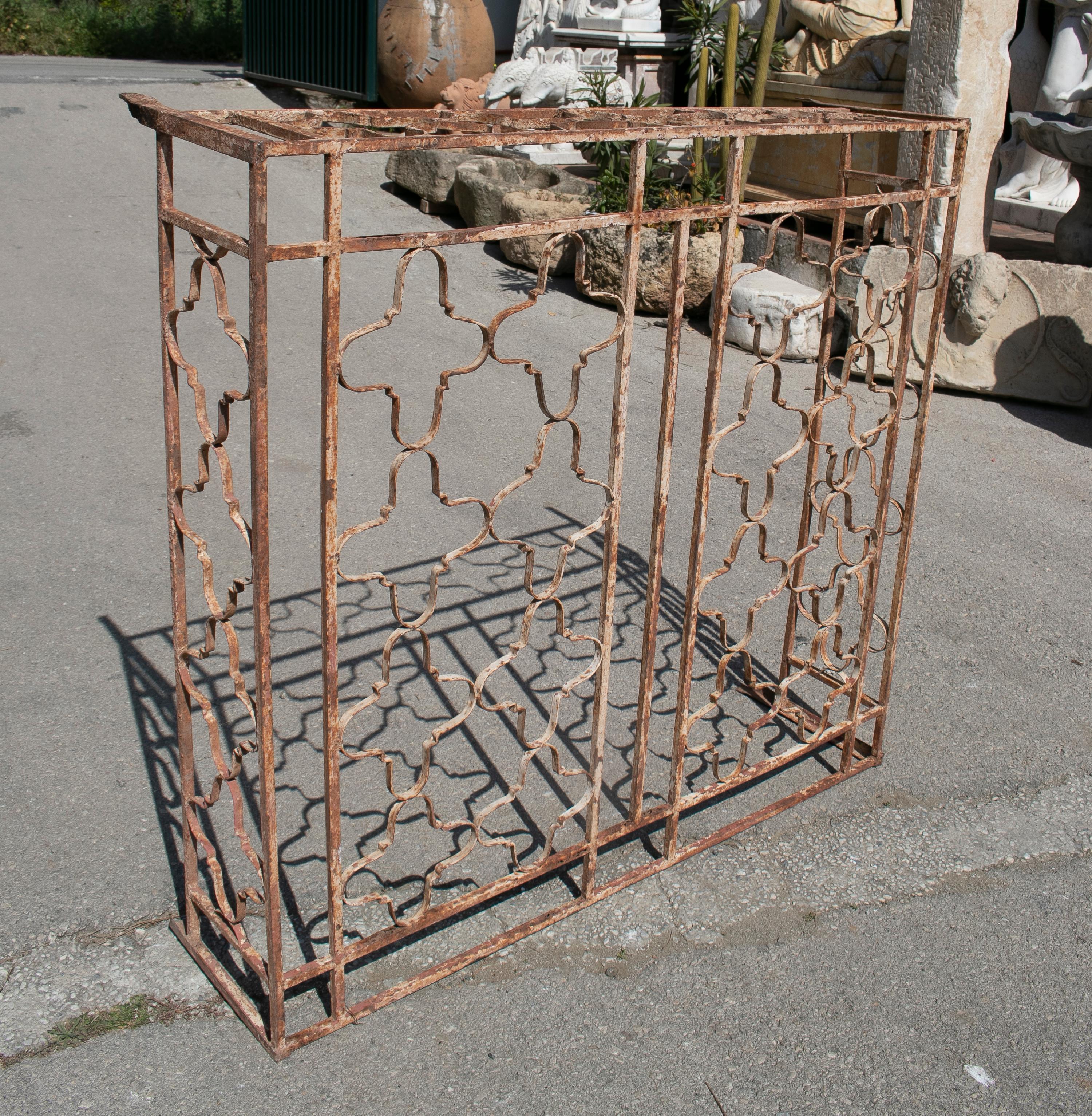 Antique 1920s Spanish wrought iron window grille.