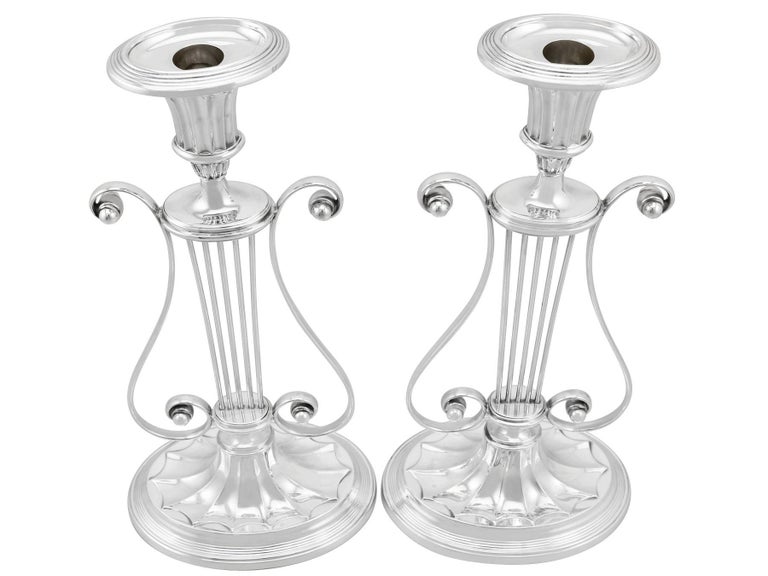 An exceptional, fine and impressive, rare pair of large antique George V English sterling silver lyre candlesticks; an addition of our ornamental silverware collection

These exceptional antique George V English sterling silver candlesticks have