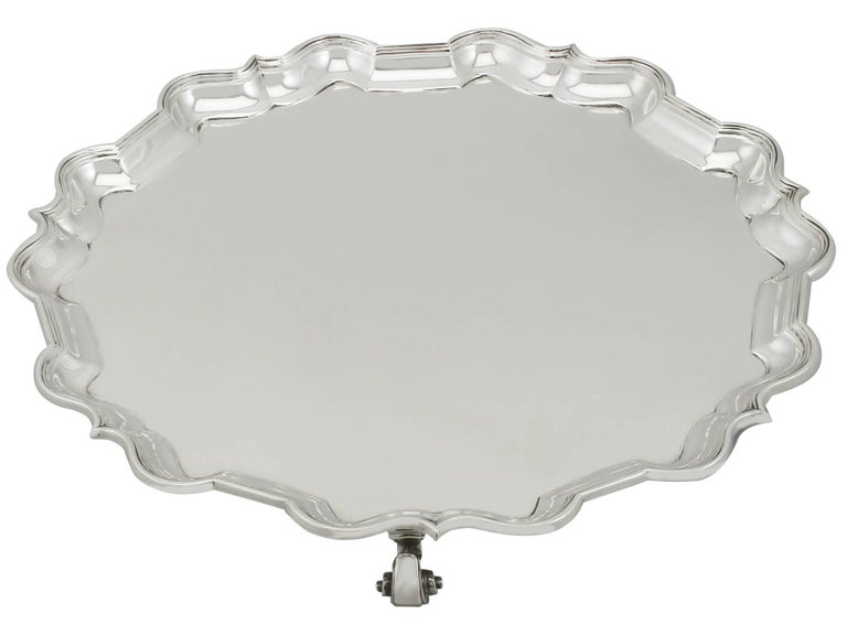 An exceptional, fine and impressive antique George V English sterling silver salver; an addition to our silver dining collection

This exceptional antique George V sterling silver salver has a circular shaped form.

The surface of this large