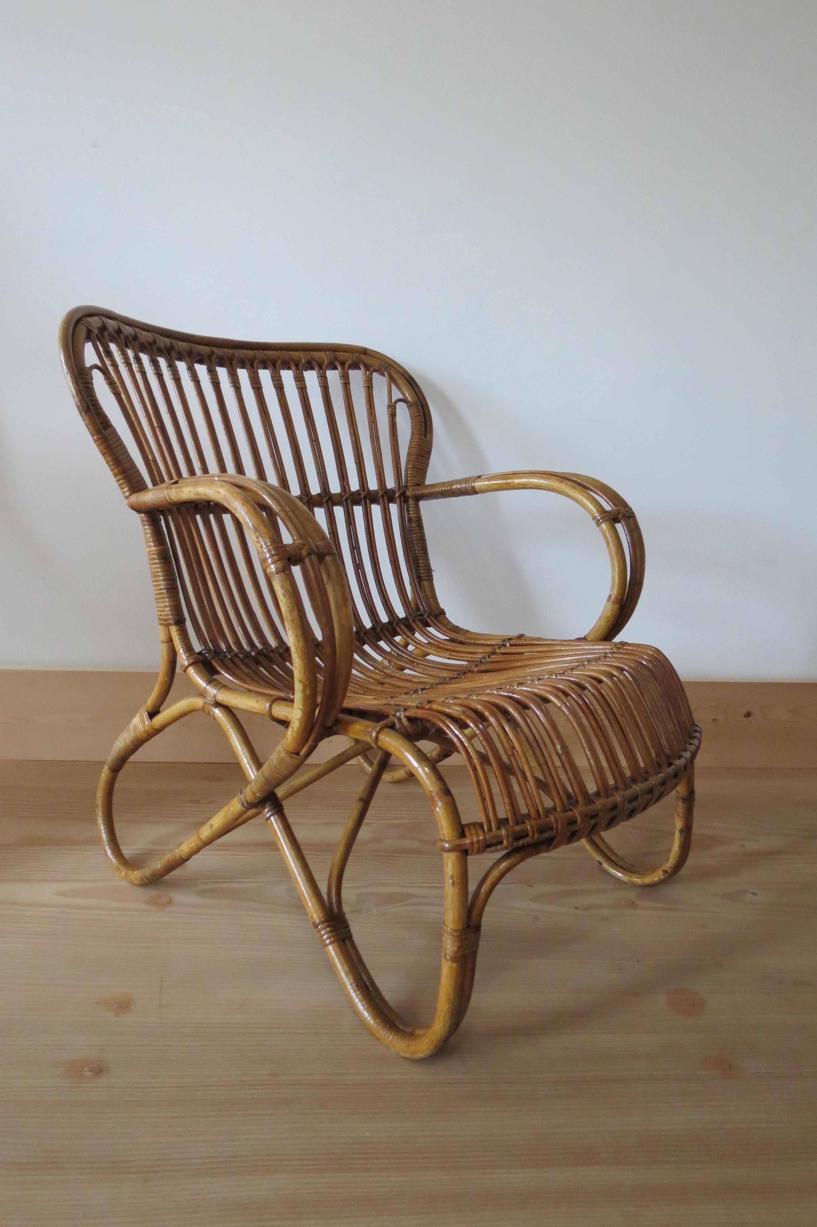 Very stylish lounge chair from the 1920s made from steam bent cane and bamboo. 
In good over all condition, nicely patinated all over.
Measures: 63cm W, 70cm D, 73cm T.


 