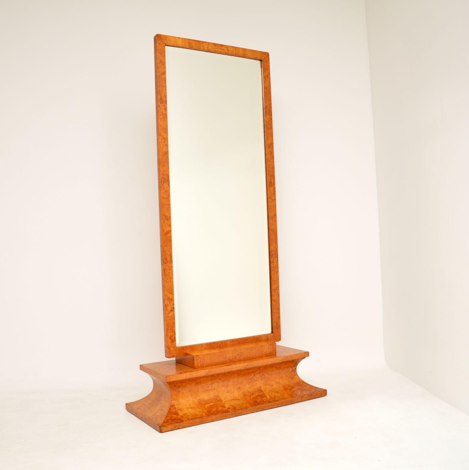 An absolutely stunning original Art Deco period free standing cheval mirror in birds eye maple. This was made in continental Europe, most likely Sweden. It was retailed in Harvey Nichols and has the original label, this dates from the