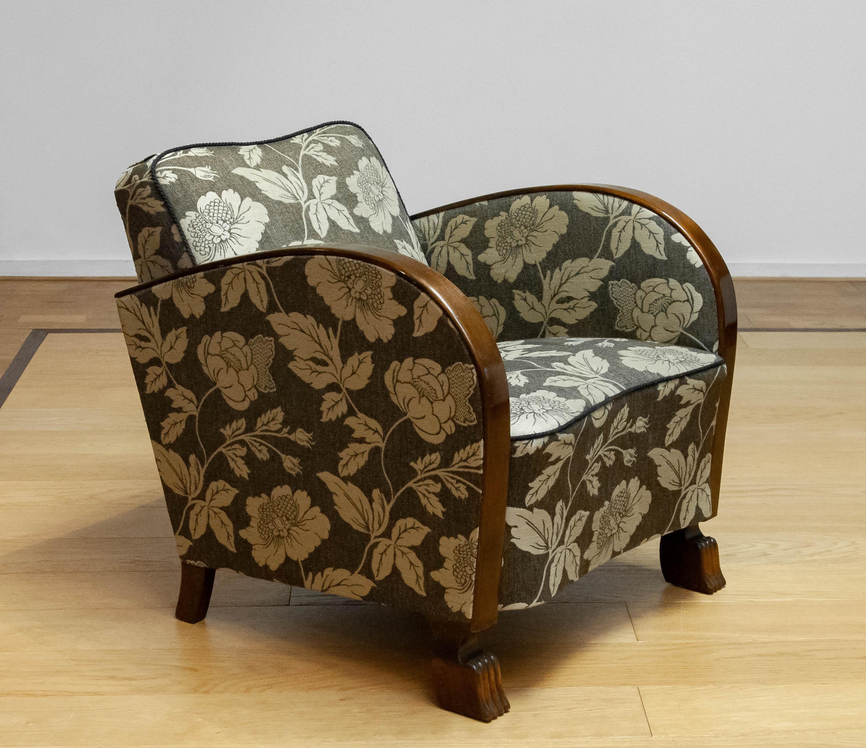 Absolutely beautiful club / lounge chair from the 1920s made in Sweden. The brown / beige jacquard fabric is from a later period and in good and clean condition. All springs and webbings are in good condition and the chair supports very good and