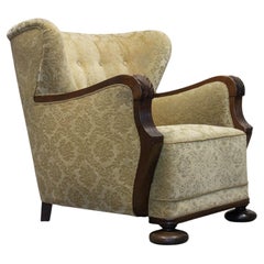 1920s Swedish Wingback Chair With Golden Velvet And Carved Oak Armrests