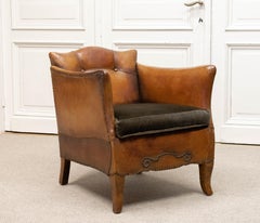 Fauteuil club en cuir fauve des années 1920 attribué à Otto Schulz pour Boet Suède