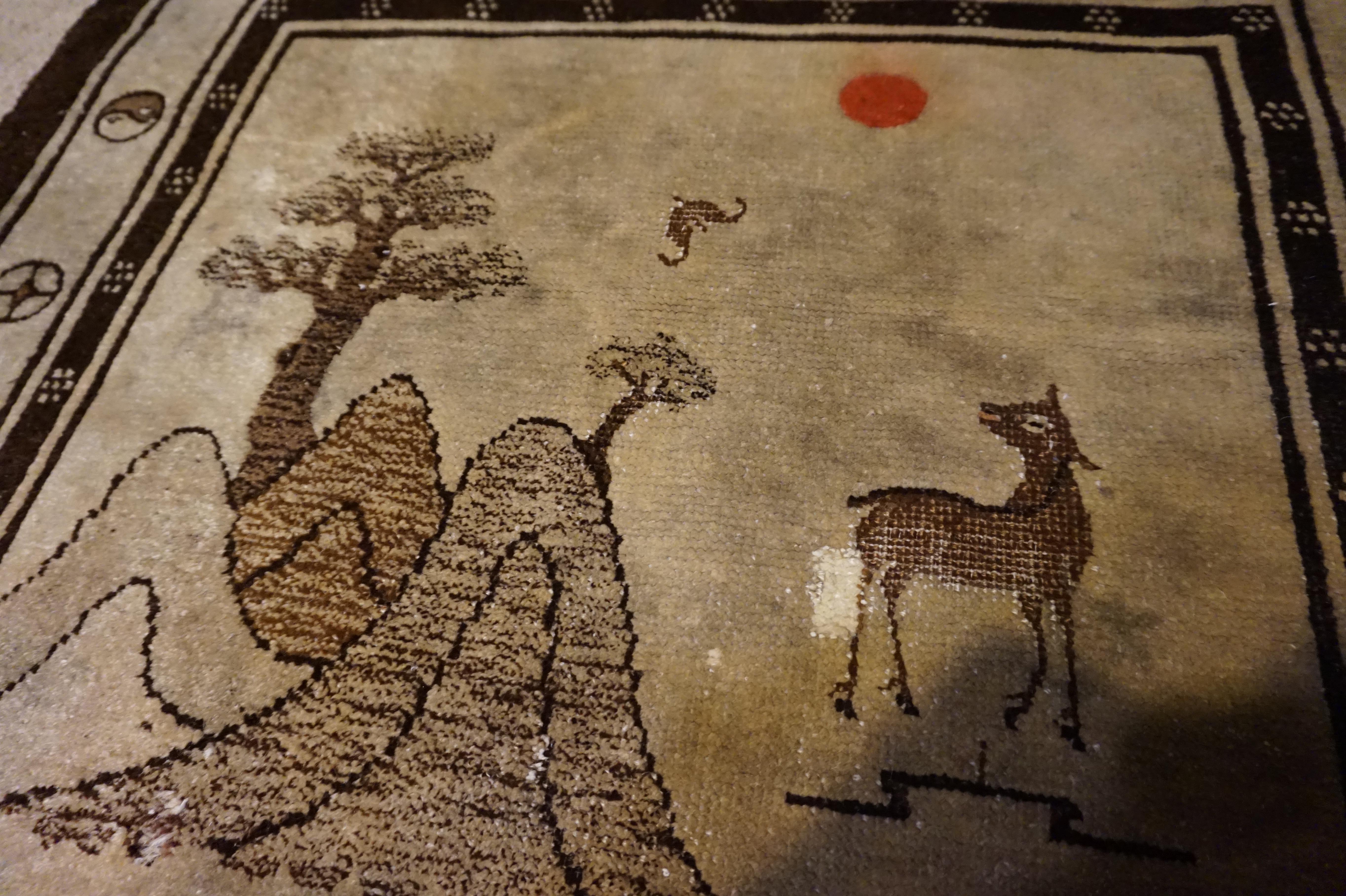 Early 20th Century 1920s Tibetan Hand Knotted Deer and Seasons Rug Symbolism Sepia Tone Red Sun