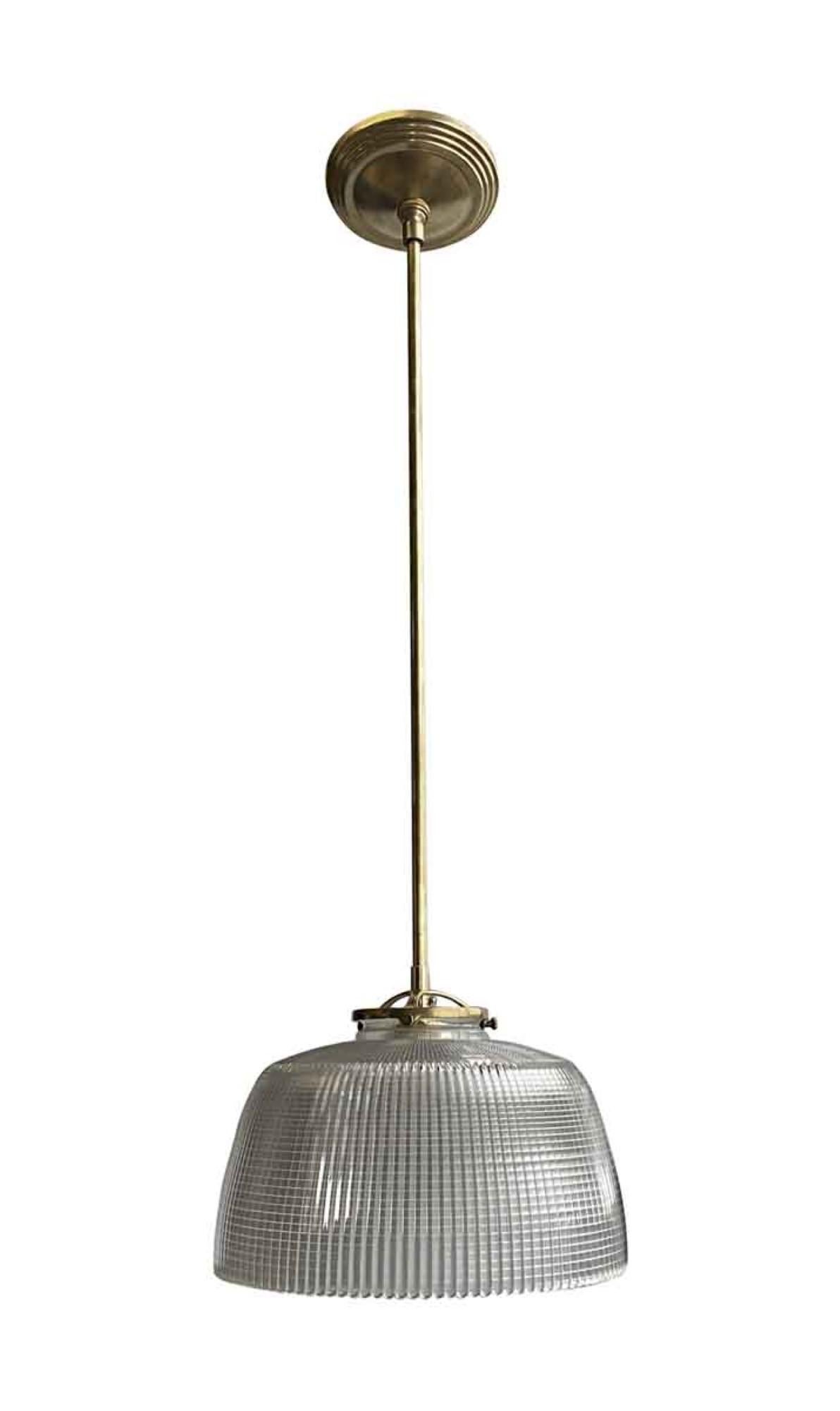Unusual 1902s clear Holophane pendant globe not fitted out with new brass hardware such as canopy. This can be seen at our 400 Gilligan St location in Scranton. PA.