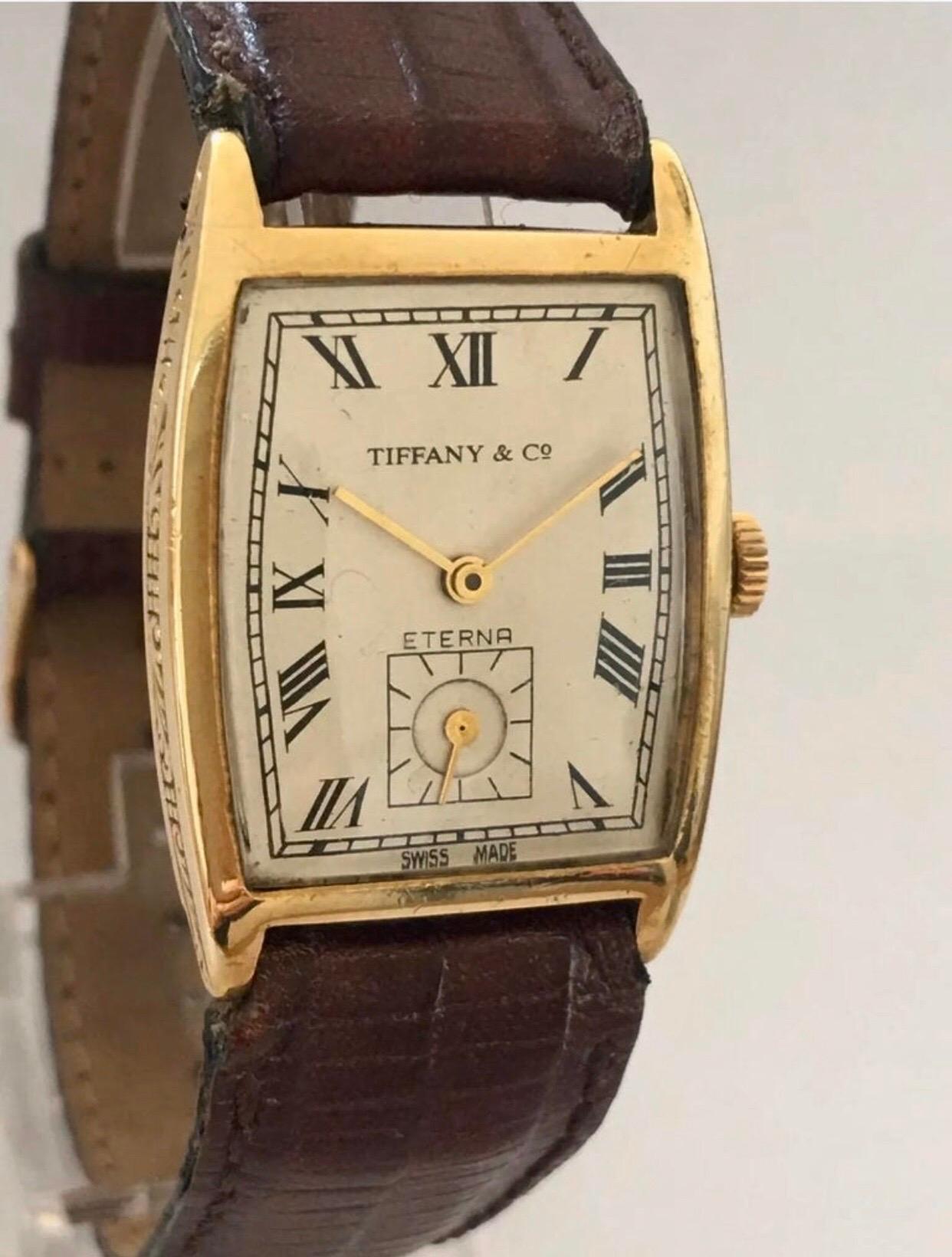 1920’s Vintage 18K Gold Tiffany & Co Eterna Hand-winding Wristwatch.

This watch is in good working condition and is running well. The strap is worn and the gold plated buckle strap is a bit tarnished. Some tiny scratches on the case and visible