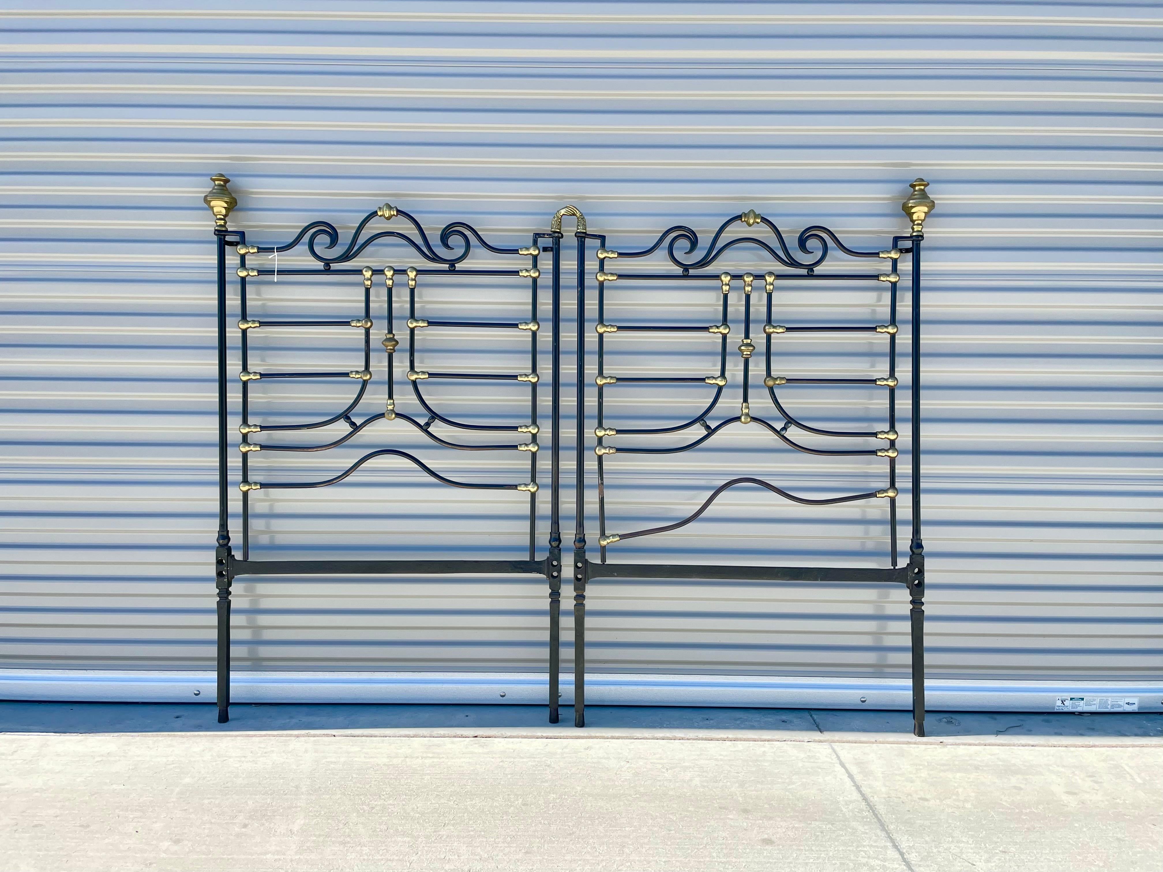 Pair of vintage iron and brass headboard, designed and manufactured in the United States circa 1920s. This unique headboard features an iron frame with a brass design.