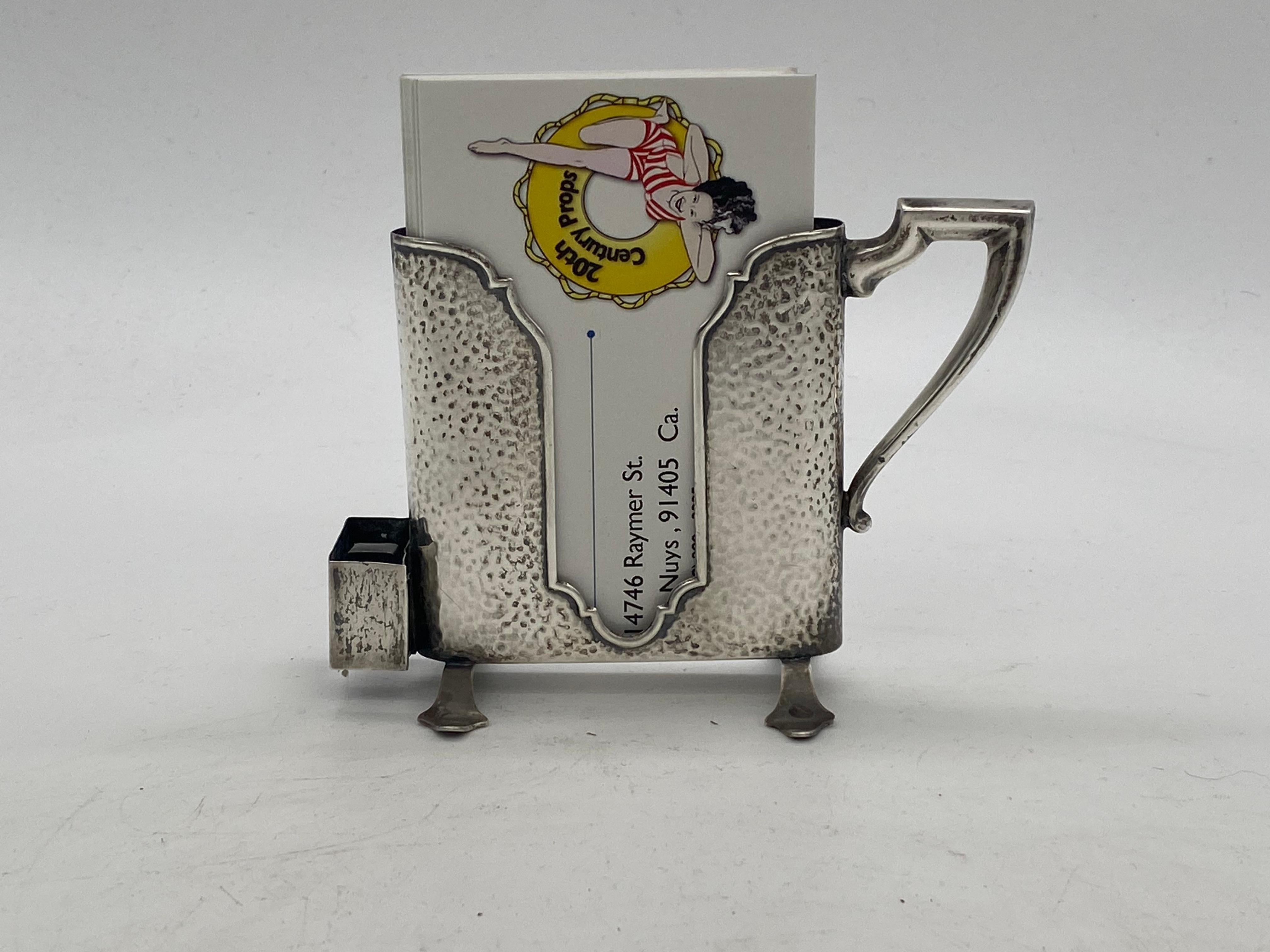 Antique Art Nouveau sterling silver match holder on a stand. It has an Art Deco style holder and a matchbox holder on the left side. This a wonderful addition to a collector of vintage tobacciana or a lover of art deco pieces. Made in the 1920s this