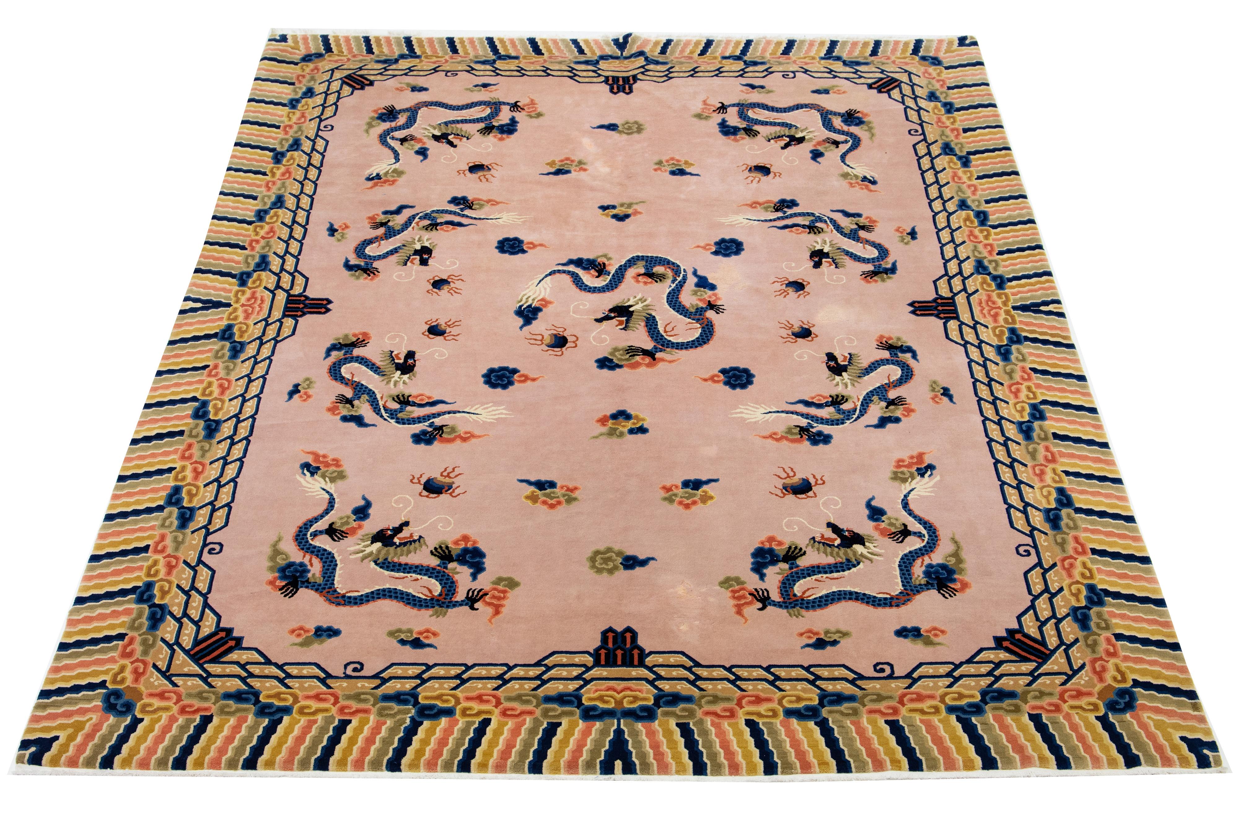 This elegant antique Peking Chinese wool rug showcases a pink-rose field with a decorative frame and multi-colored accents in a stunning all-over Chinese classic motif.

This rug measures 9' x 12'.

 