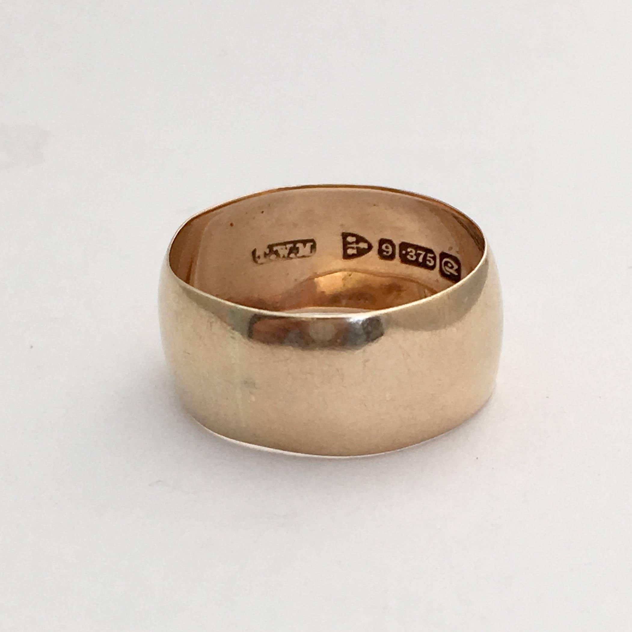 This beautiful deep wedding band dates from the roaring 20s and has been well-loved over the years. It is full of subtle character with its slightly curved design and gorgeous warm rose gold. It looks beautifully stylish worn alone, but also makes a