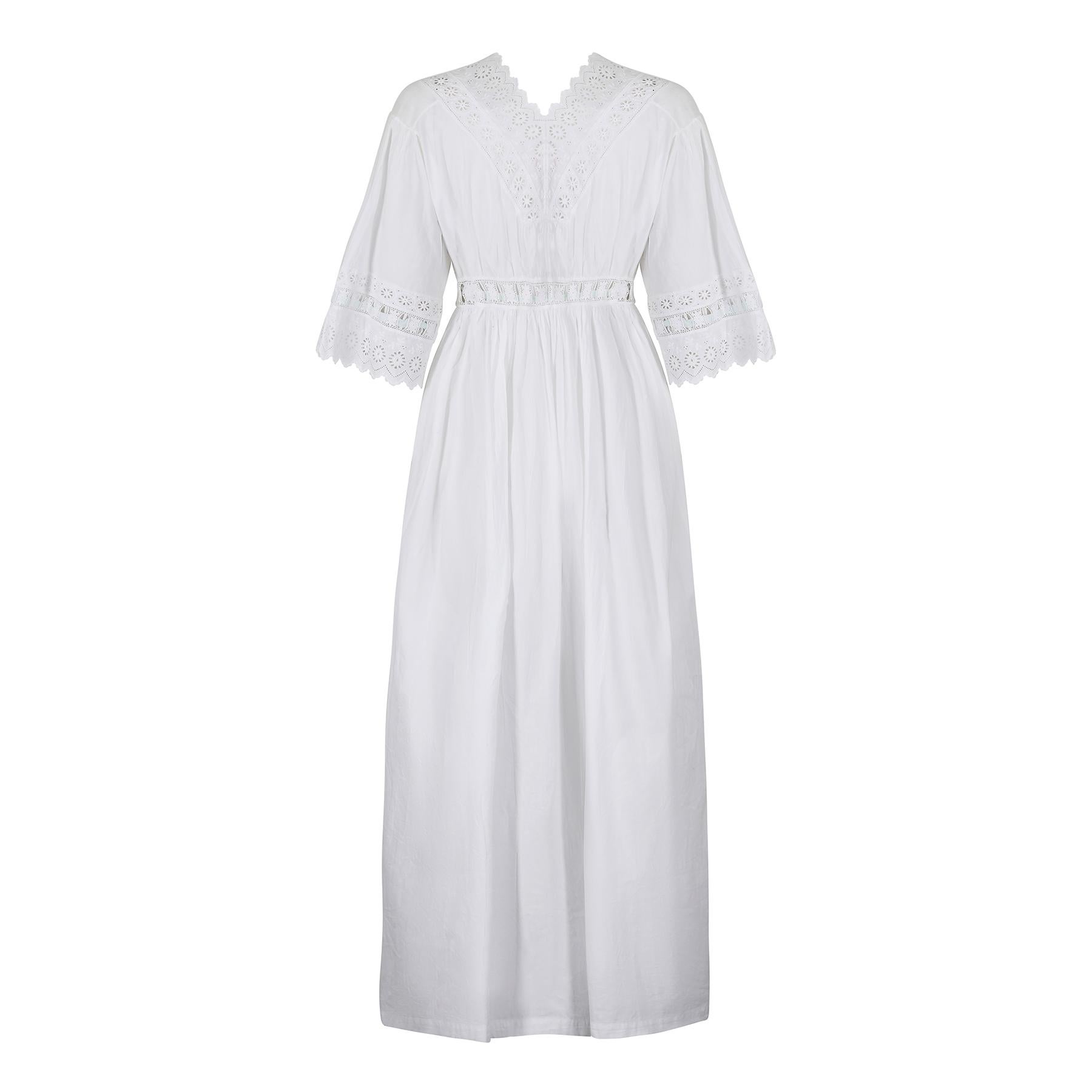 This antique 1920s whitework and ribbon dress is a really beautiful and fresh example of night wear from the era or even a bit earlier. It looks so modern and could easily be worn as day wear. The bodice is of particular note - made with machined