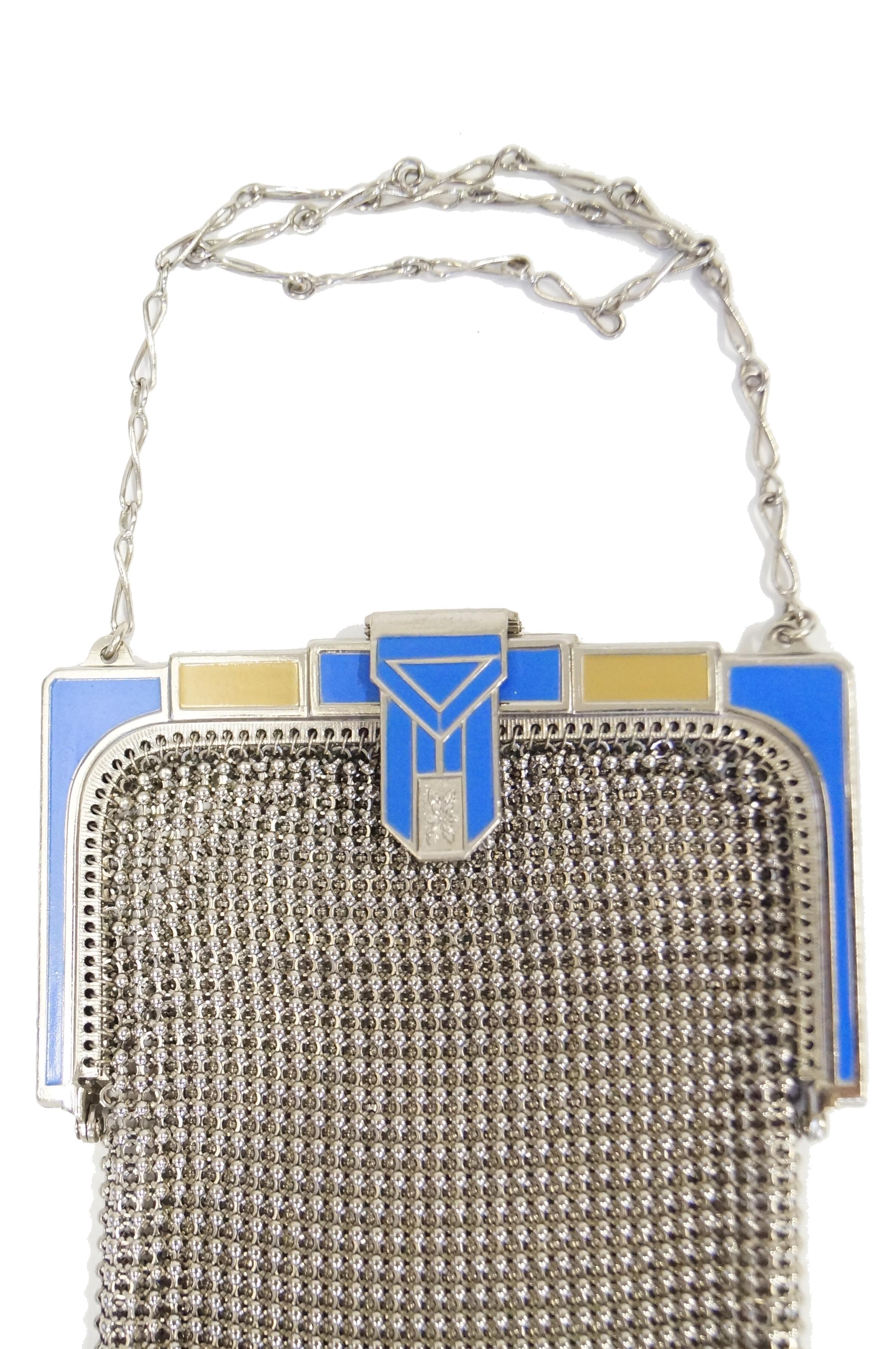 Elegant 1920s Whiting and Davis evening purse! This gorgeous mesh purse features a pressed art deco geometric triangular clasp featuring accents of bright blue enamel. The mesh body of the purse is unpainted, allowing one to admire the intricacies