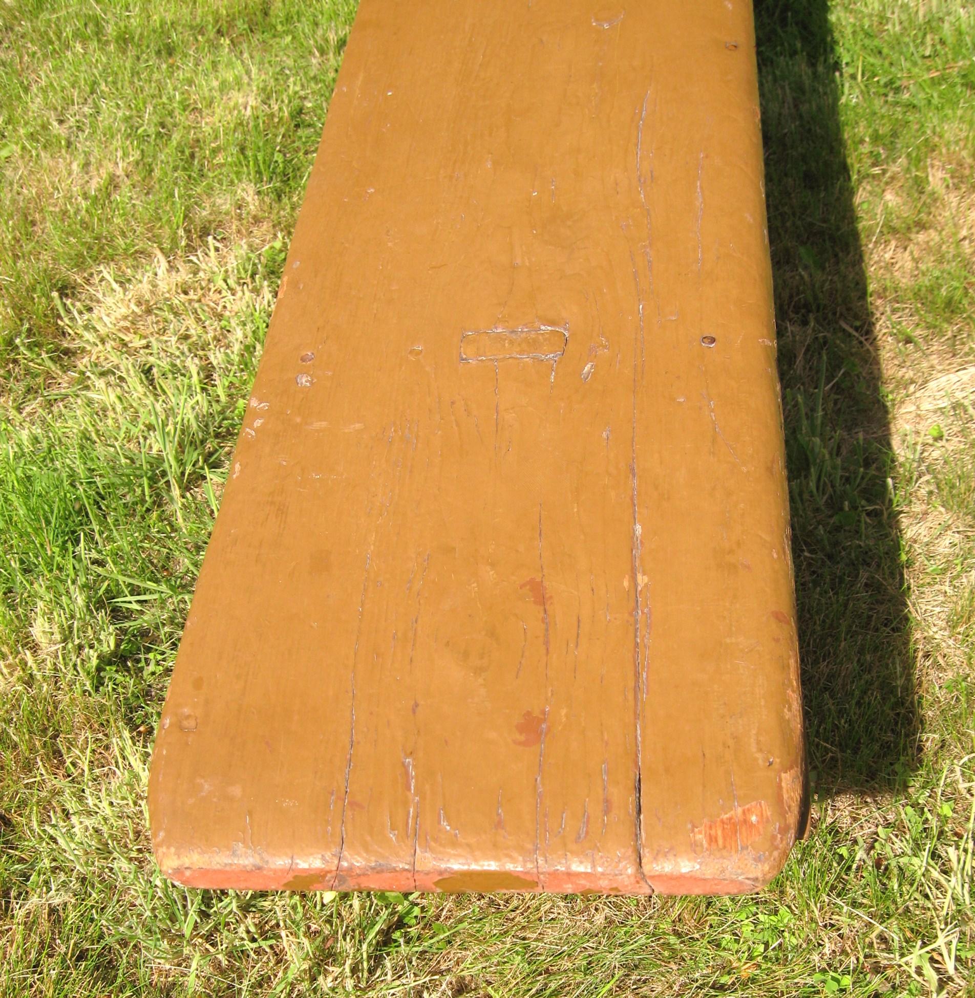 This is a wonderful 1920s pine bench, it has been painted a wonderful Golden putty color over its original red wash. It is mortised and it shows a lot of regional wear. It has wonderful boot jack feet. Another wonderful piece that came out of my