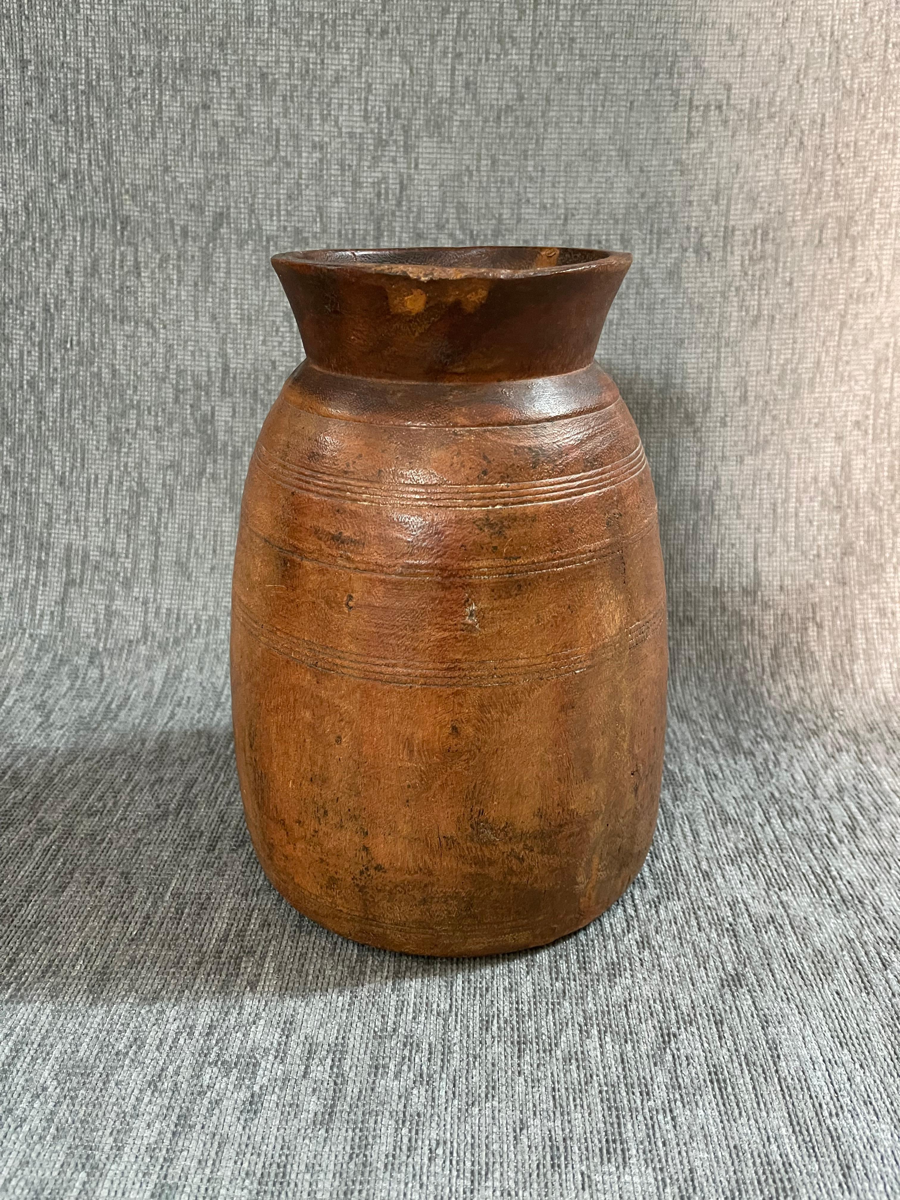 1920s  Wood Himachal Pot
This seemingly simple wooden vase is a design object of infinite beauty and elegance that can be placed in either an antique or a modern or contemporary setting.
They are Indian artefacts from the Himachal Pradesh region and