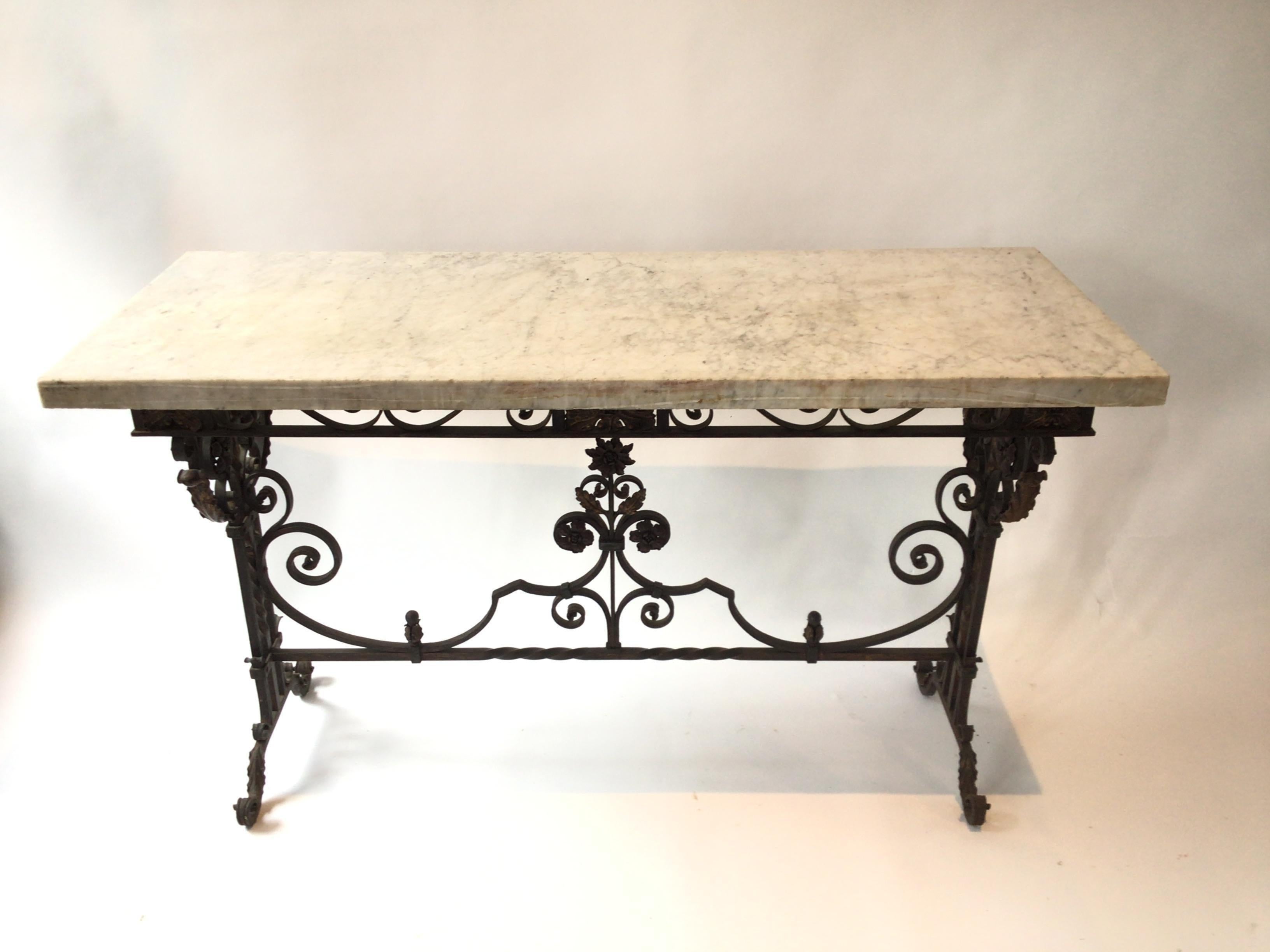 1920s Wrought iron with a thick marble top console from a Southampton, NY estate.