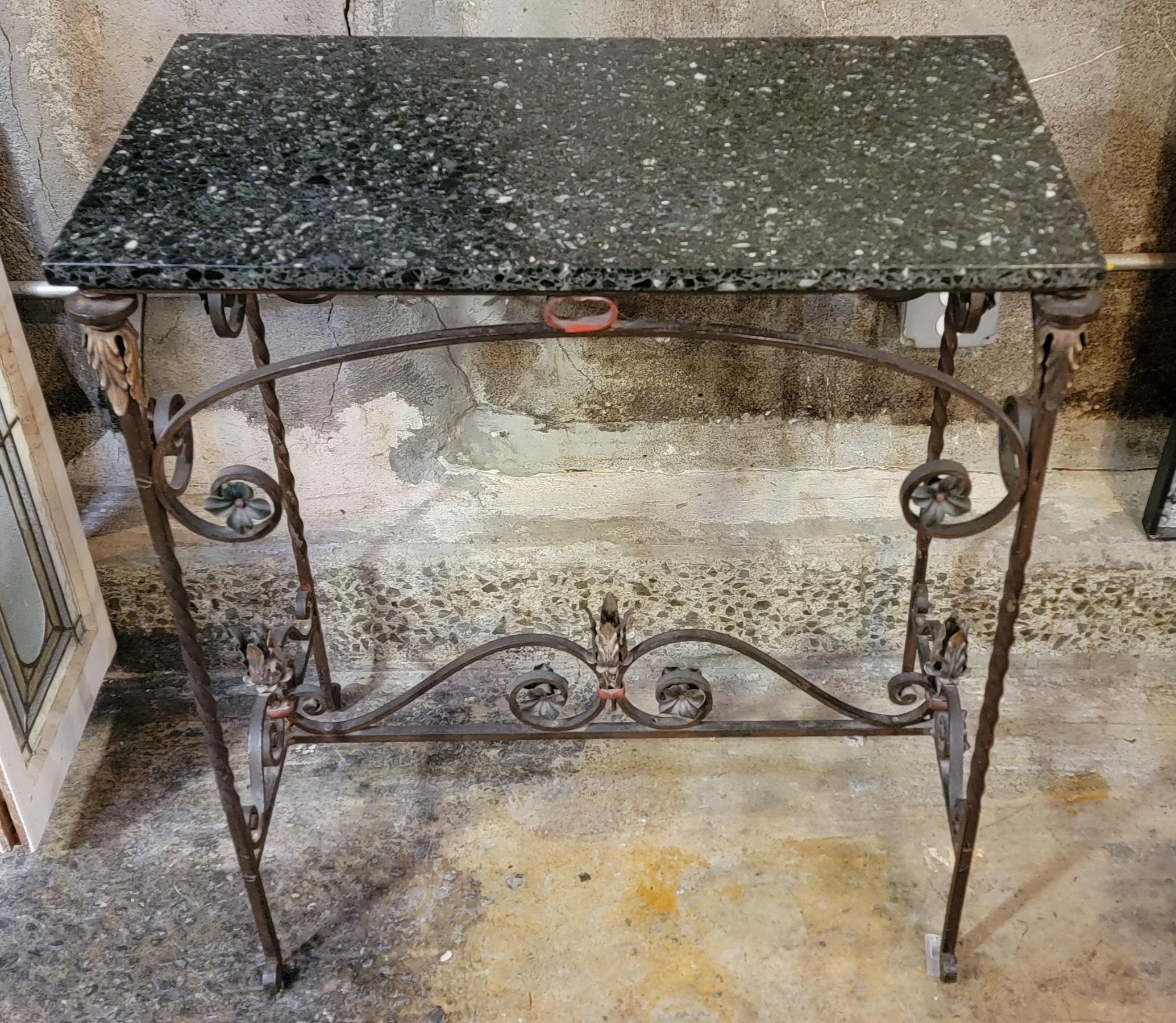 Very nice example of a 1920's wrought iron side or console table. Retains original marble top and original painted iron.