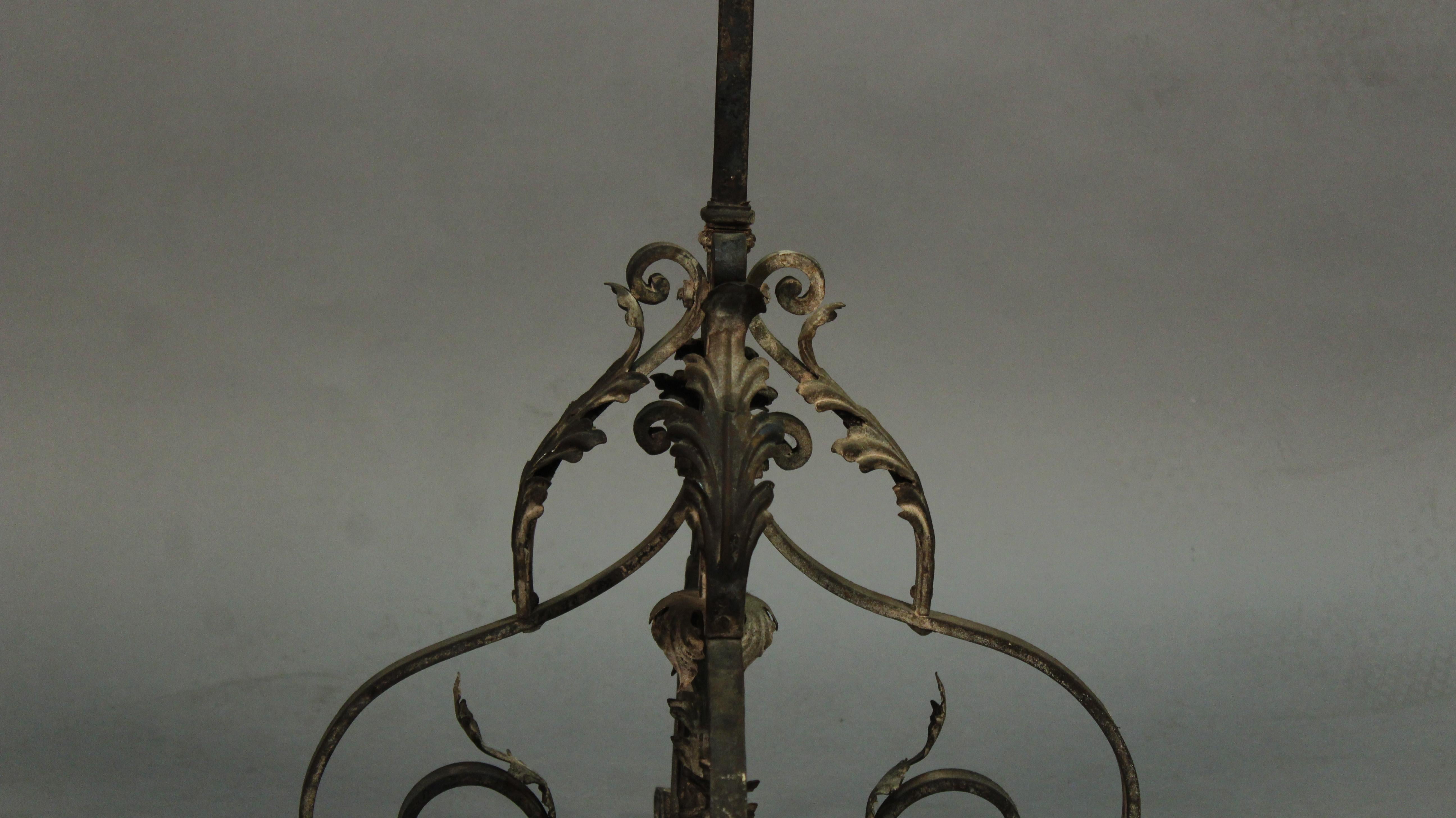 Tall 1920s single candleholder with beautiful iron work. Measures: 71